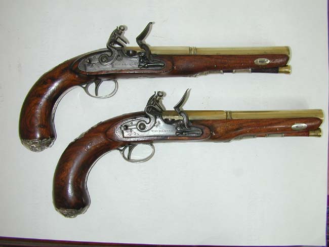 A Fine Pair of Flintlock Silver Mounted Brass Barreled Officer's Pistols Circa 1778
