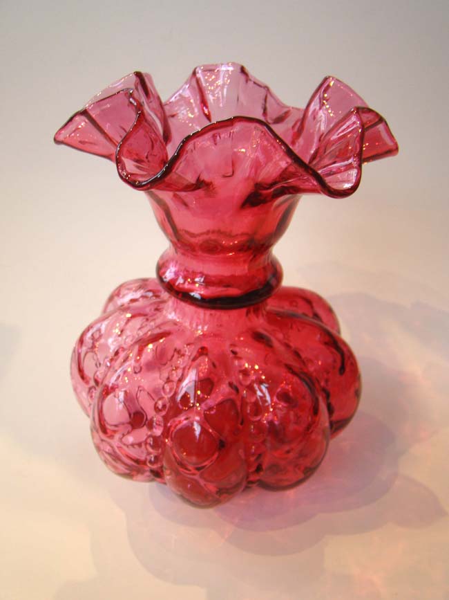 An attractive vintage cranberry glass vase