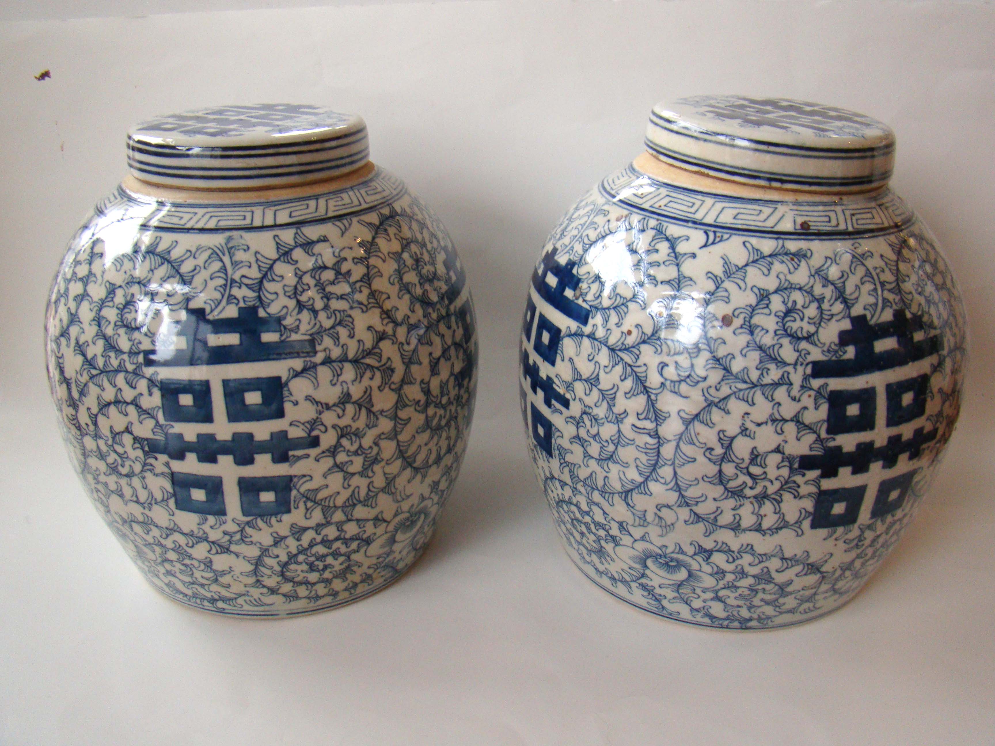 A pair of Chinese ginger jars with the symbols for "Double Happiness"