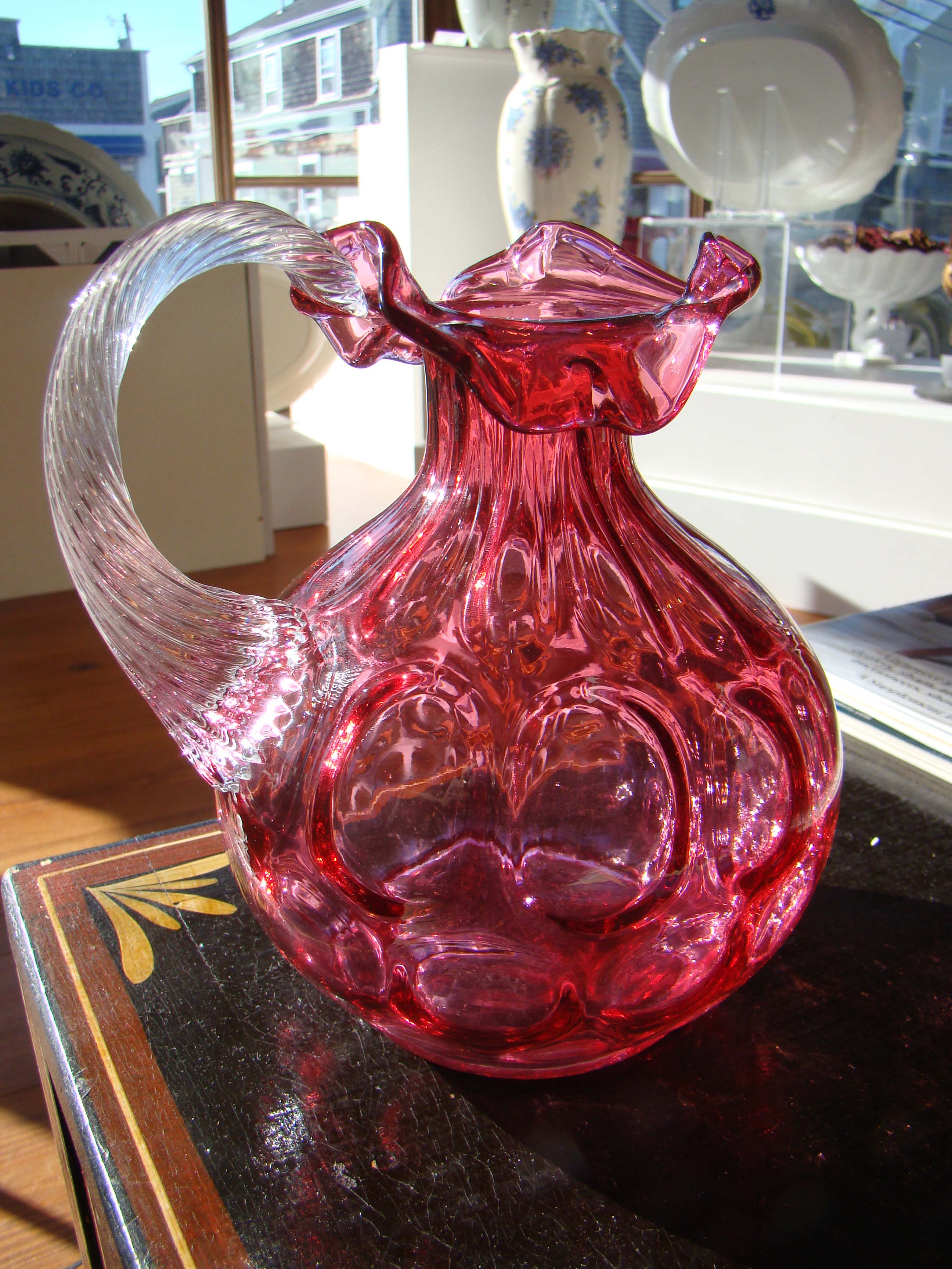 A beautiful vintage signed FENTON cranberry glass jug