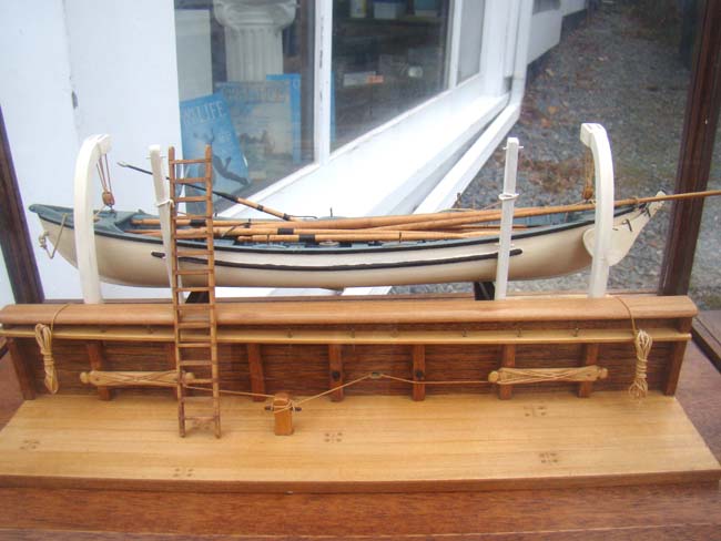 A very fine whaleboat model secured by davits to the hull of a whaling ship — image 2