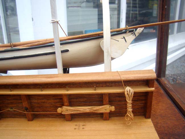 A very fine whaleboat model secured by davits to the hull of a whaling ship — image 4