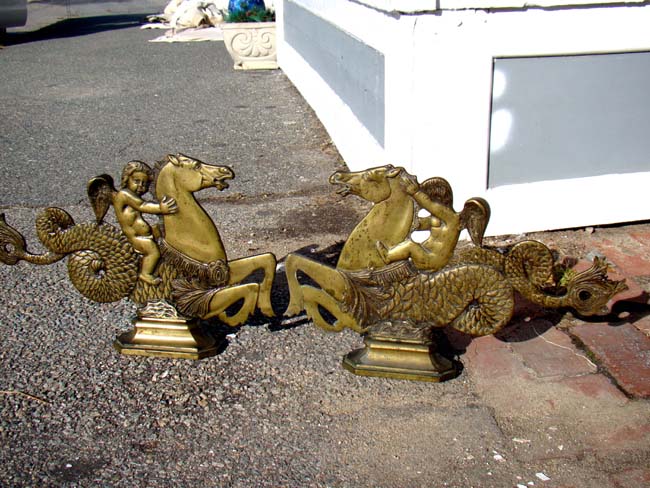 A fine and RARE pair of 19th century solid bronze Venetian Gondola Ornaments featuring a cherub riding a seahorse