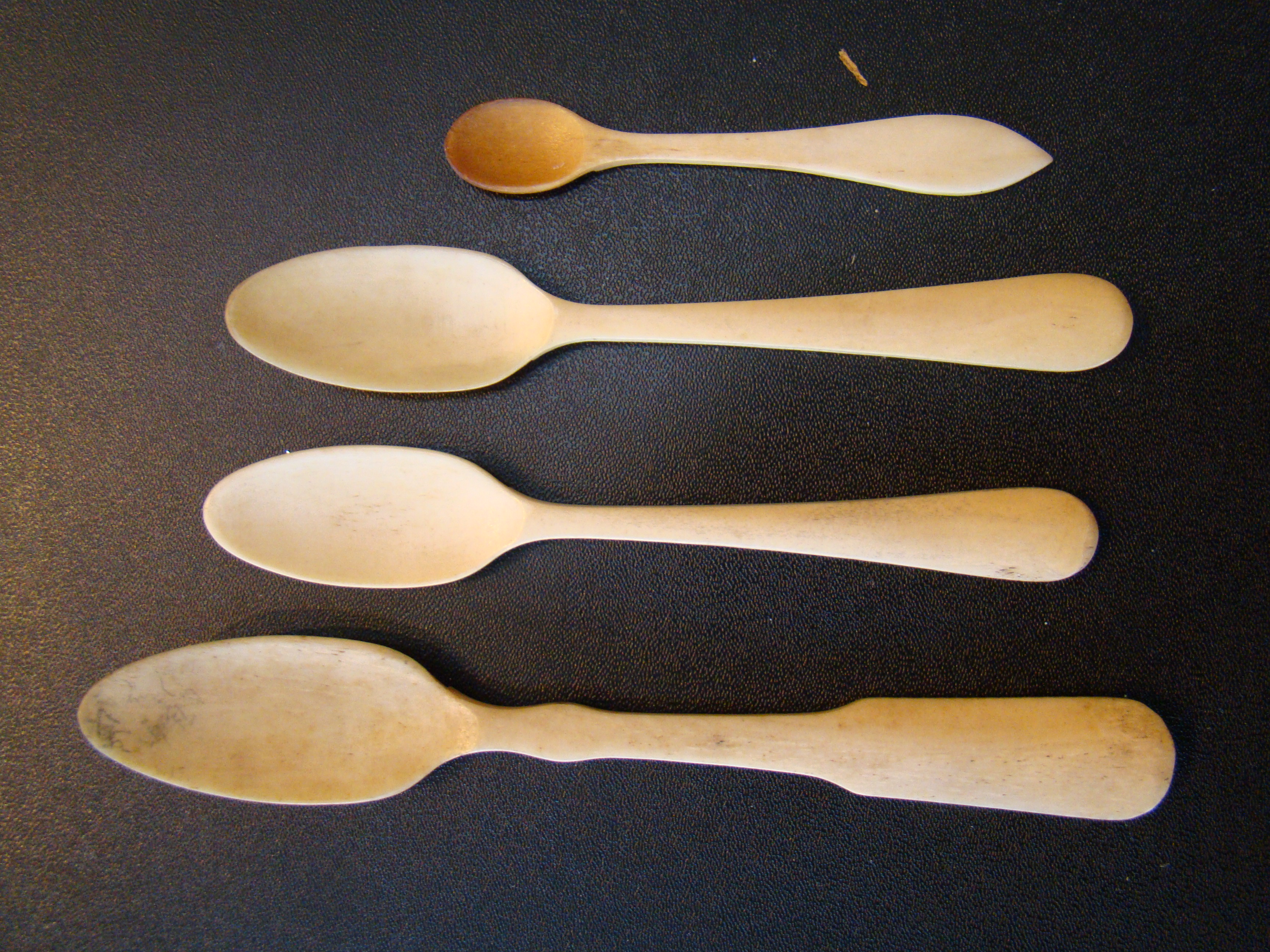 A group of four 19th century sailor-made whalebone spoons