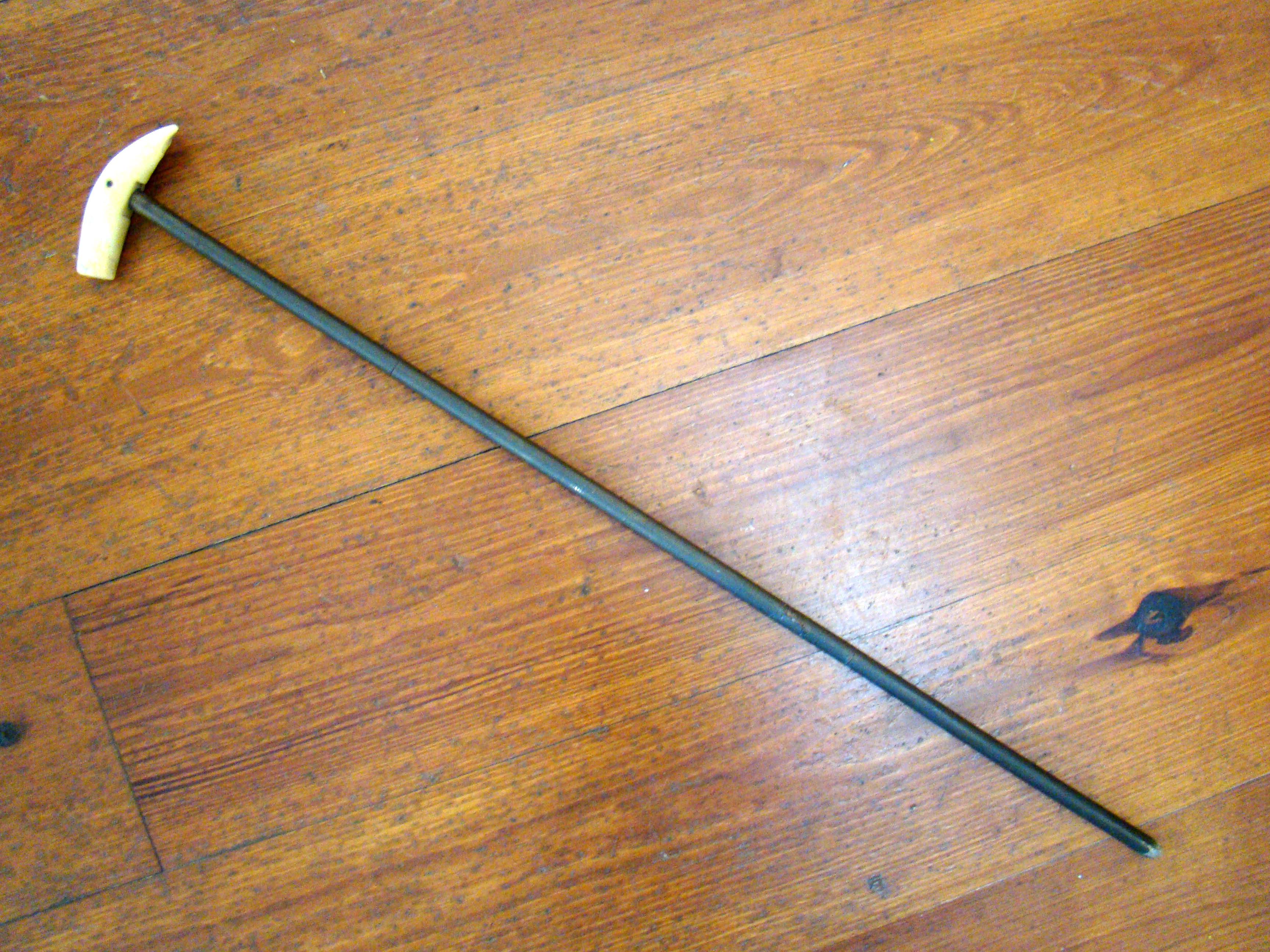 A 19th century walking stick with whale tooth handle.