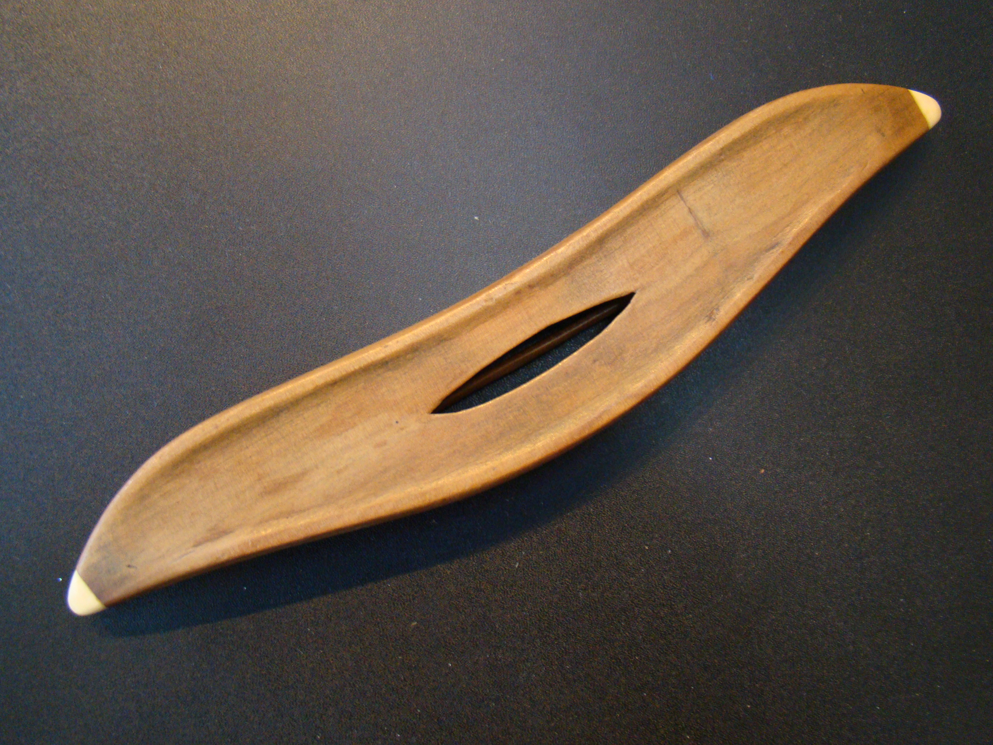 A beautiful 19th century hand carved sewing or weaving shuttle with whale ivory tips — image 2