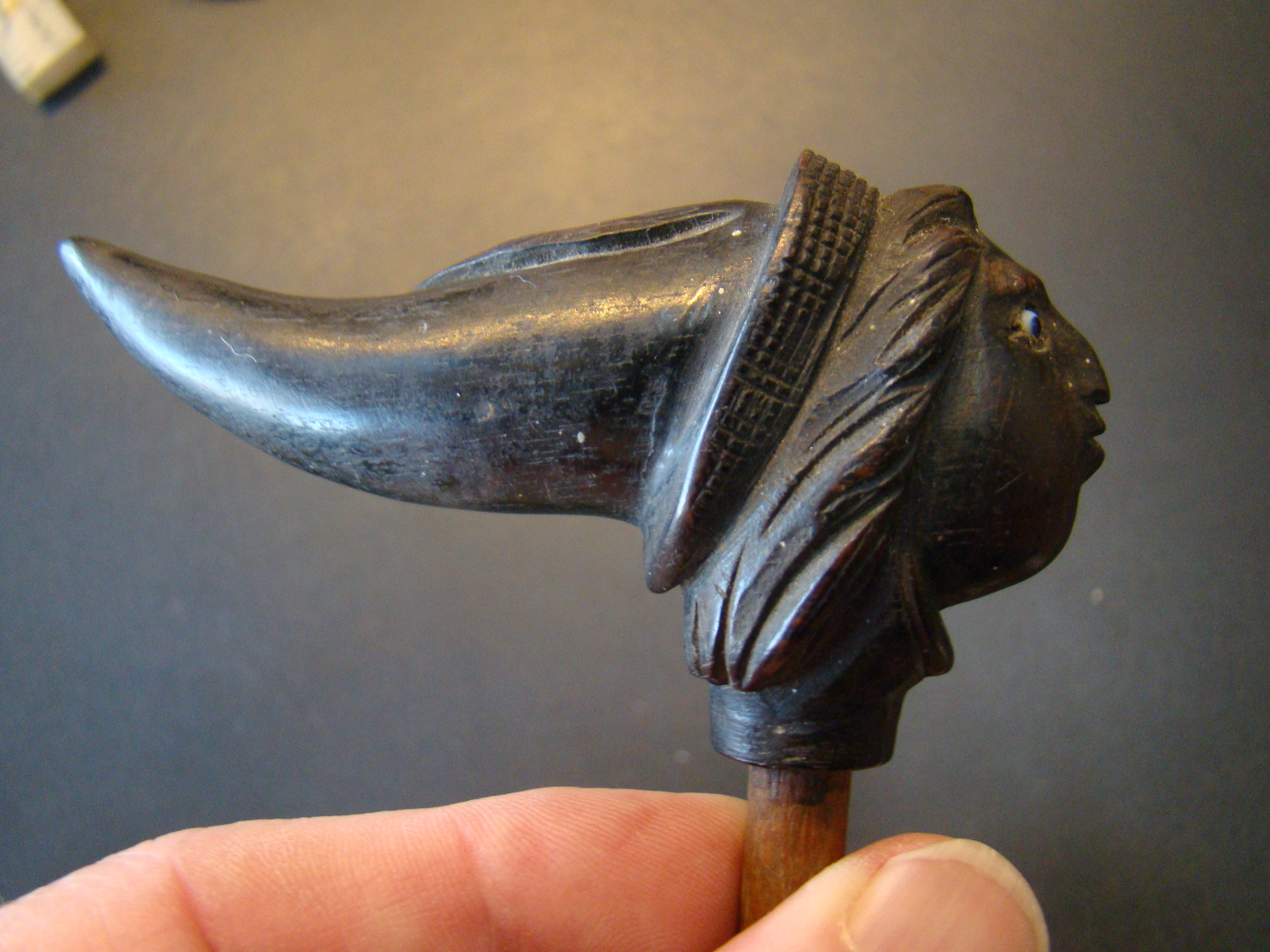 A wonderful 19th century baleen or carved ebony cane handle in the form of a woman