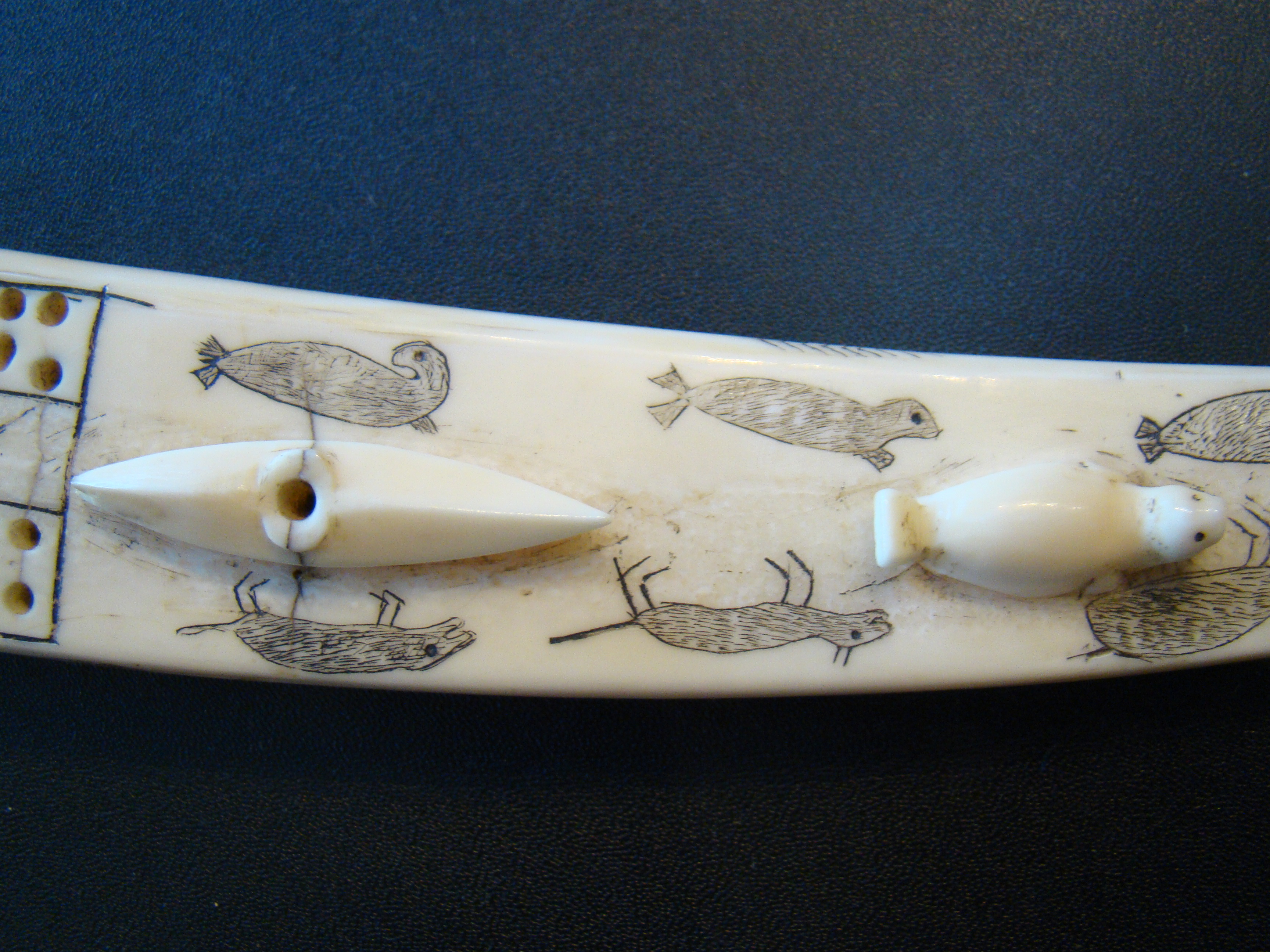 An exceptionally fine Inuit carved antique walrus tusk cribbage board — image 5