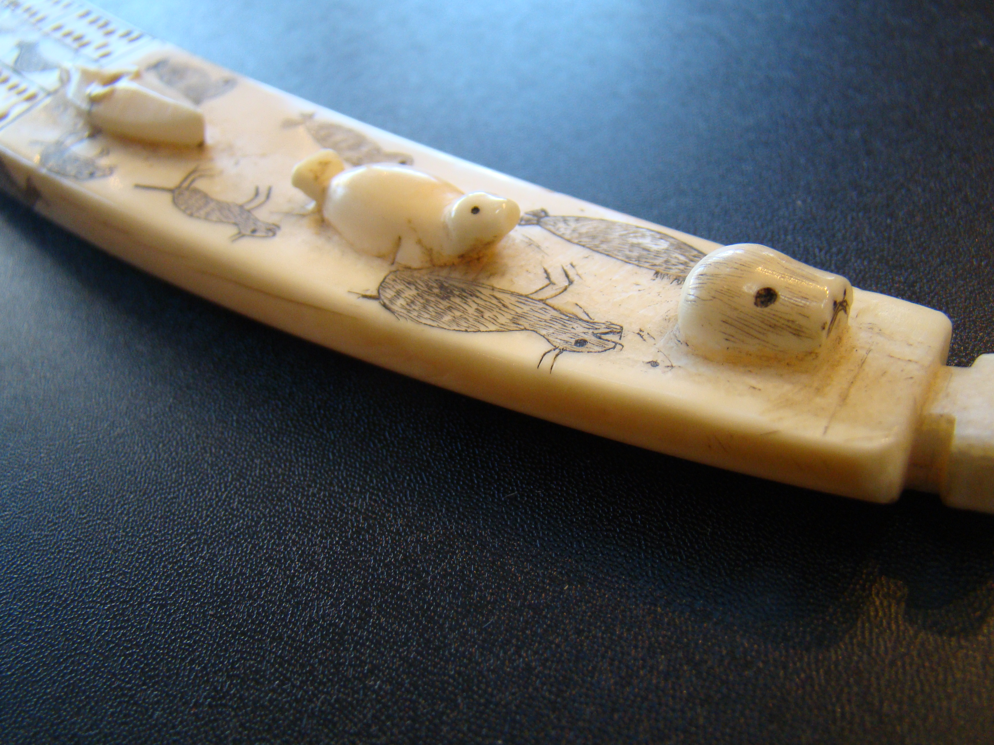 An exceptionally fine Inuit carved antique walrus tusk cribbage board — image 6