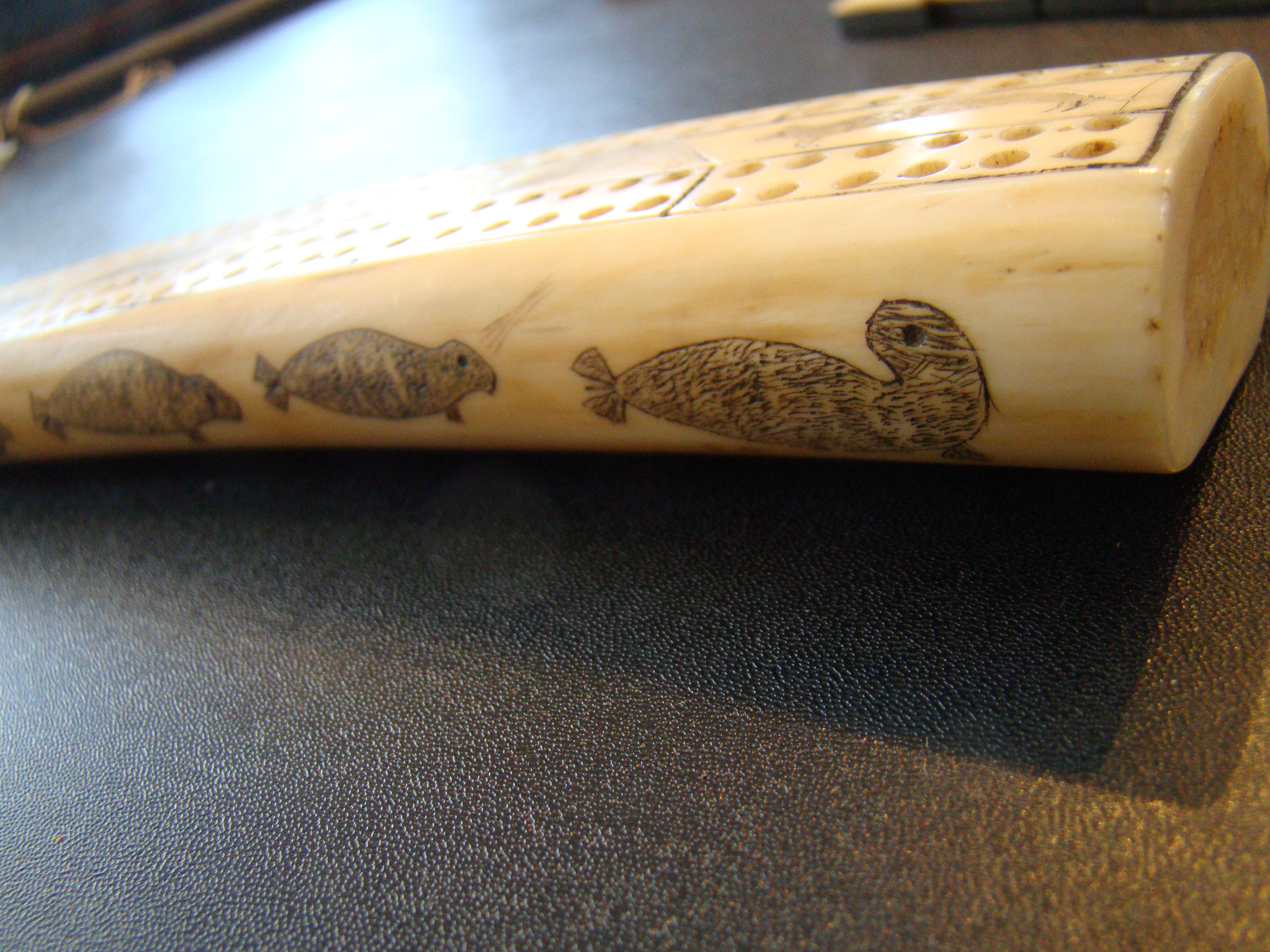 An exceptionally fine Inuit carved antique walrus tusk cribbage board — image 7