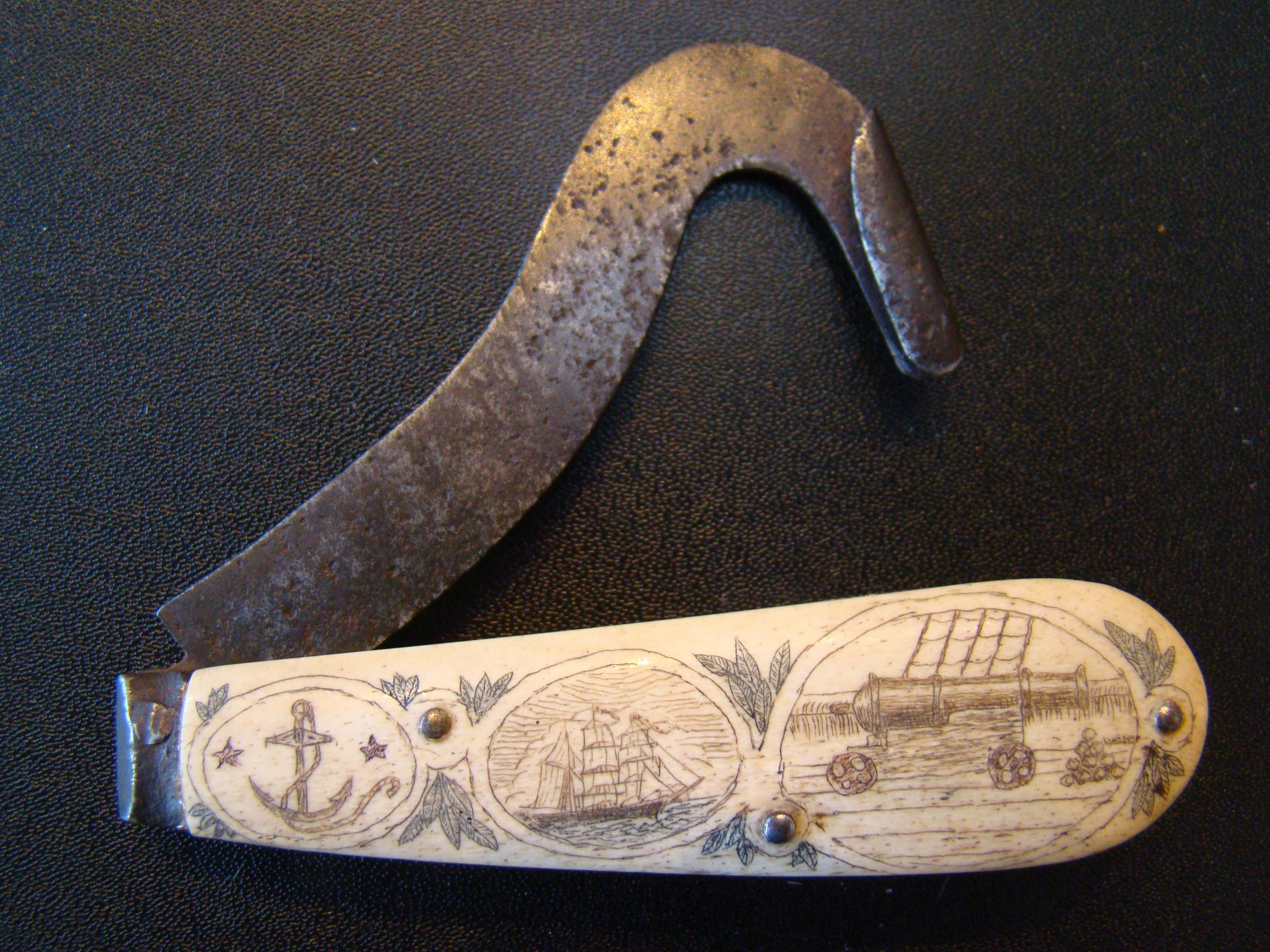 A FABULOUS 19th century sailor's folding tool with wonderful scrimshawed handle