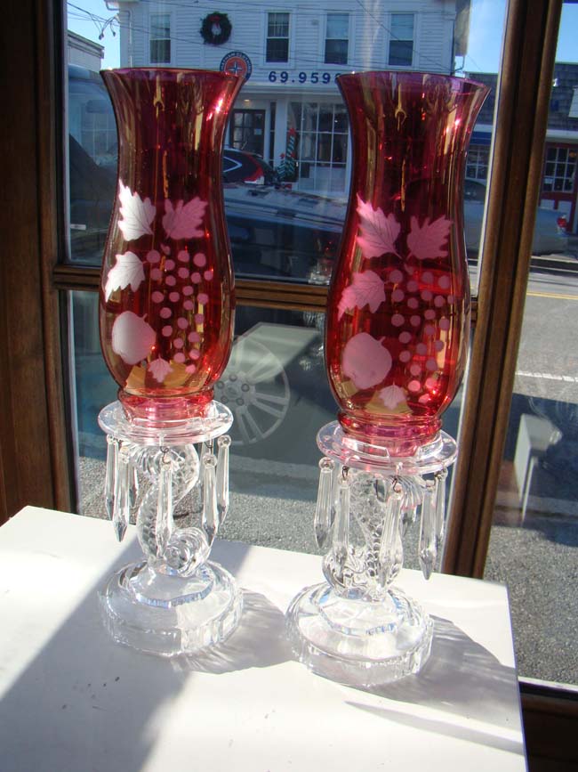 A fabulous pair of vintage dolphin form candlesticks with removable etched glass hurricanes circa 1890-1910