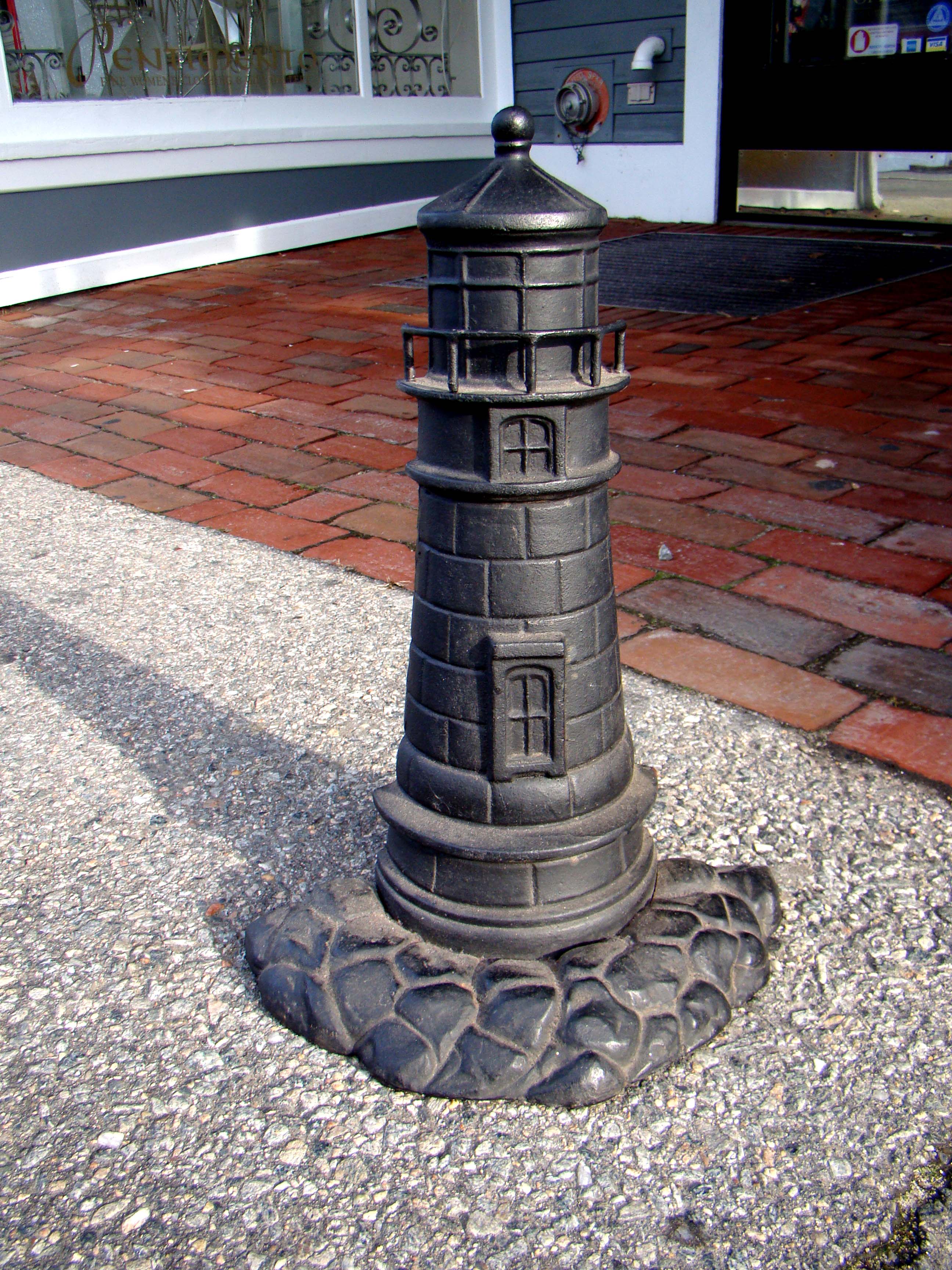 A wonderful cast iron Lighthouse form doorstop circa 1890.