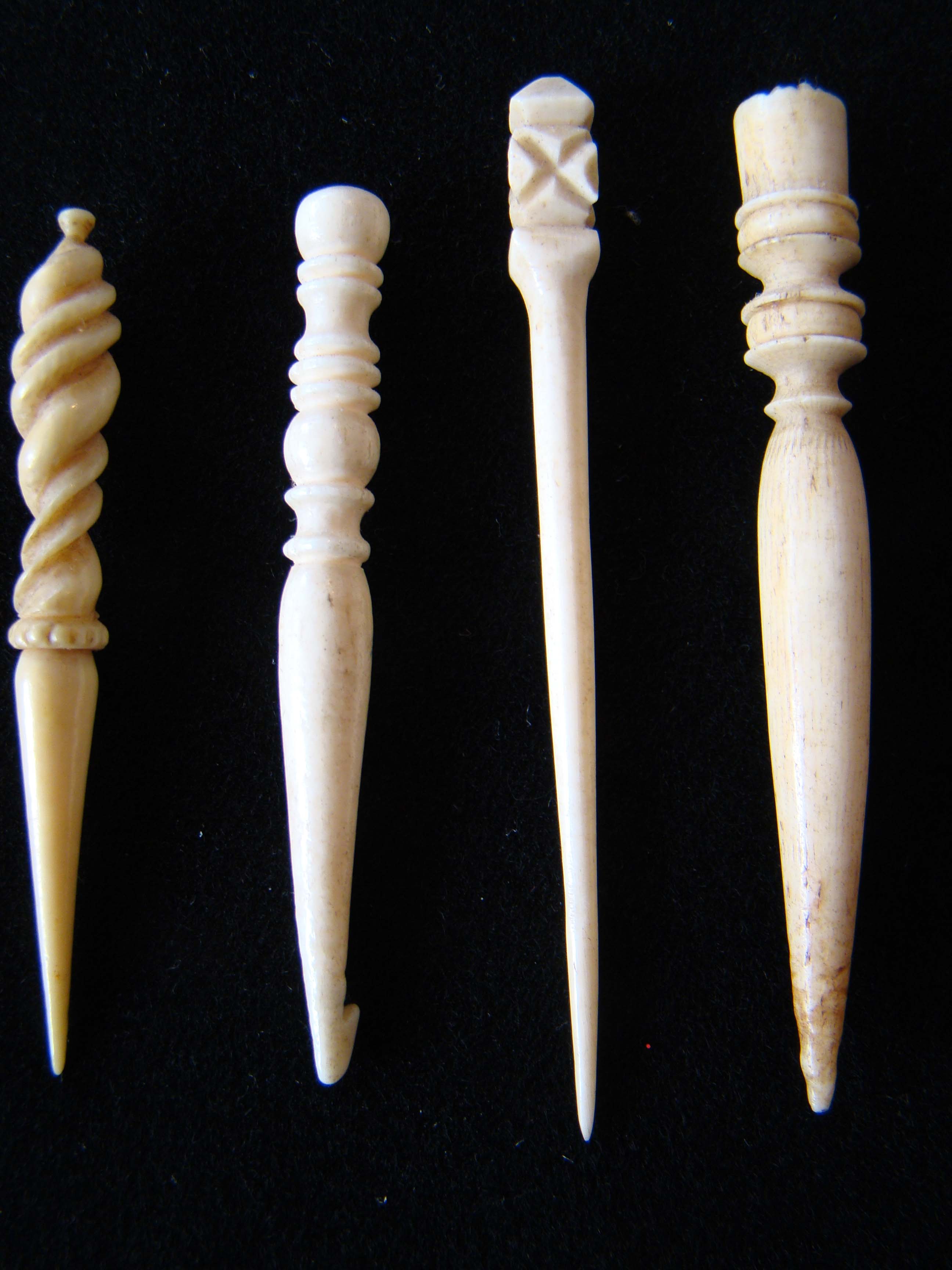 A fine group of four 19th century sailor-carved whale 'ivory' and whalebone bodkins circa 1830-1880