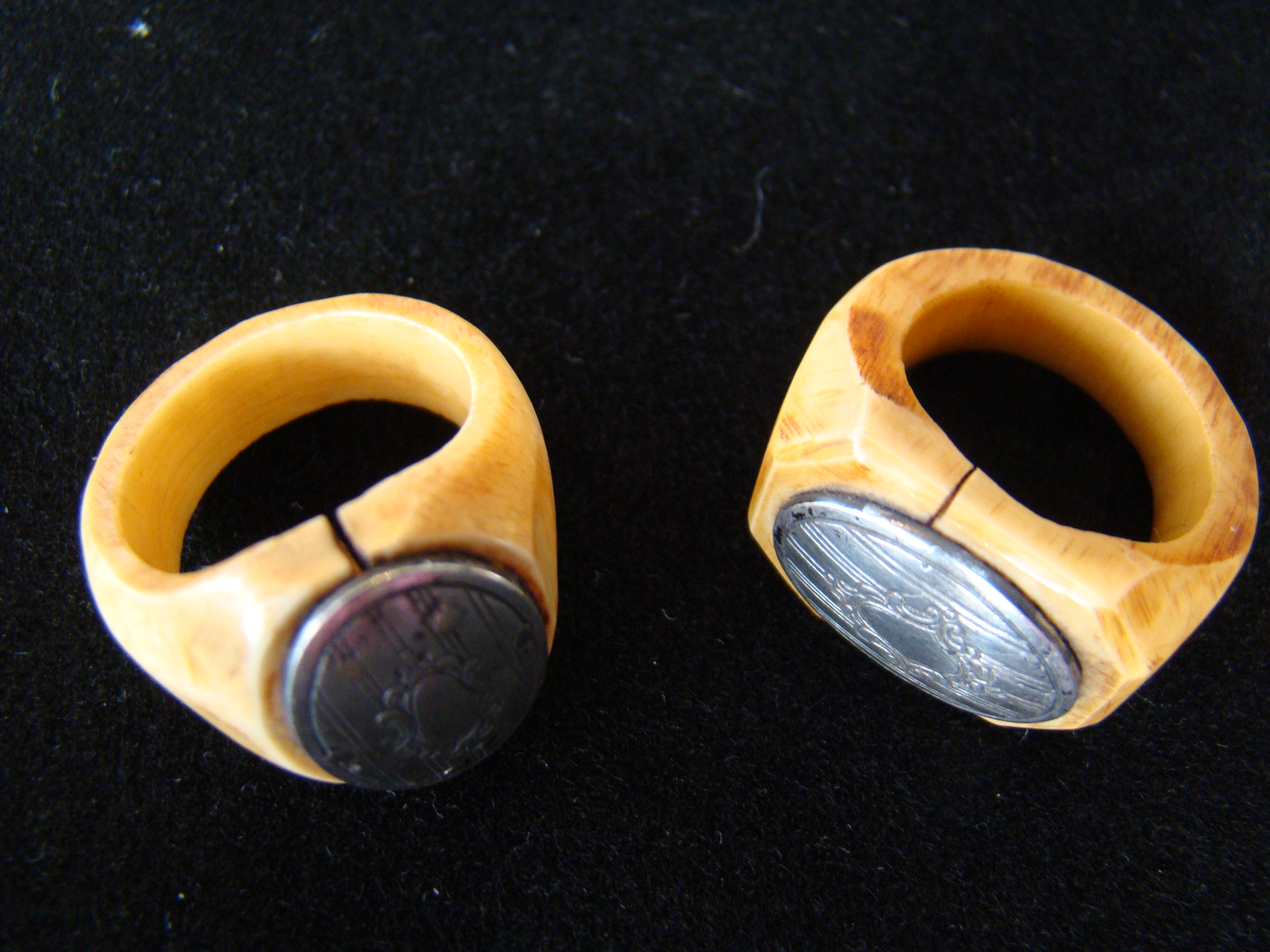 A RARE pair of 19th century  sailor-carved whale ivory signet style rings with engraved silver inset