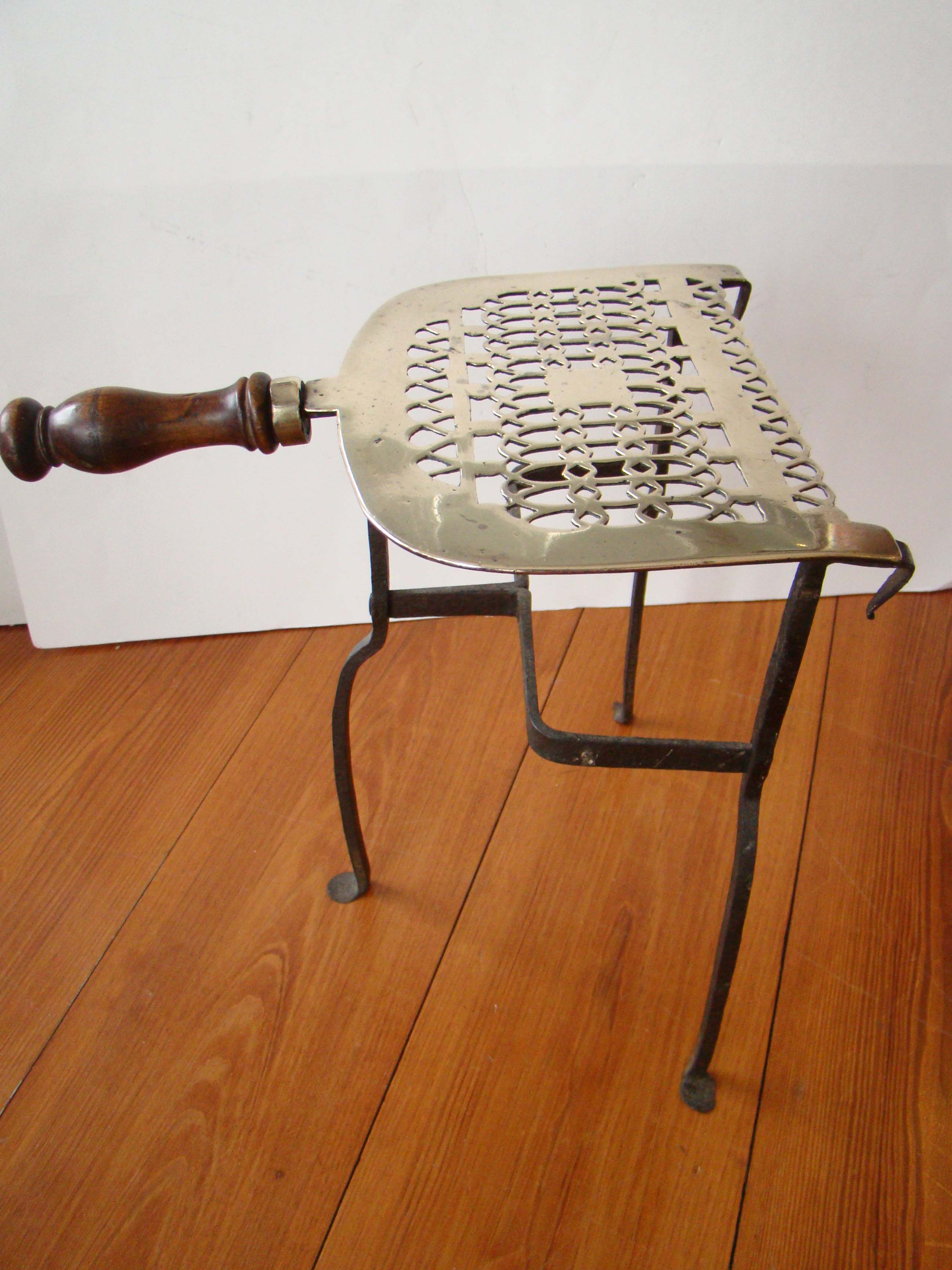 A beautiful early 19th century brass hearth trivet circa 1820