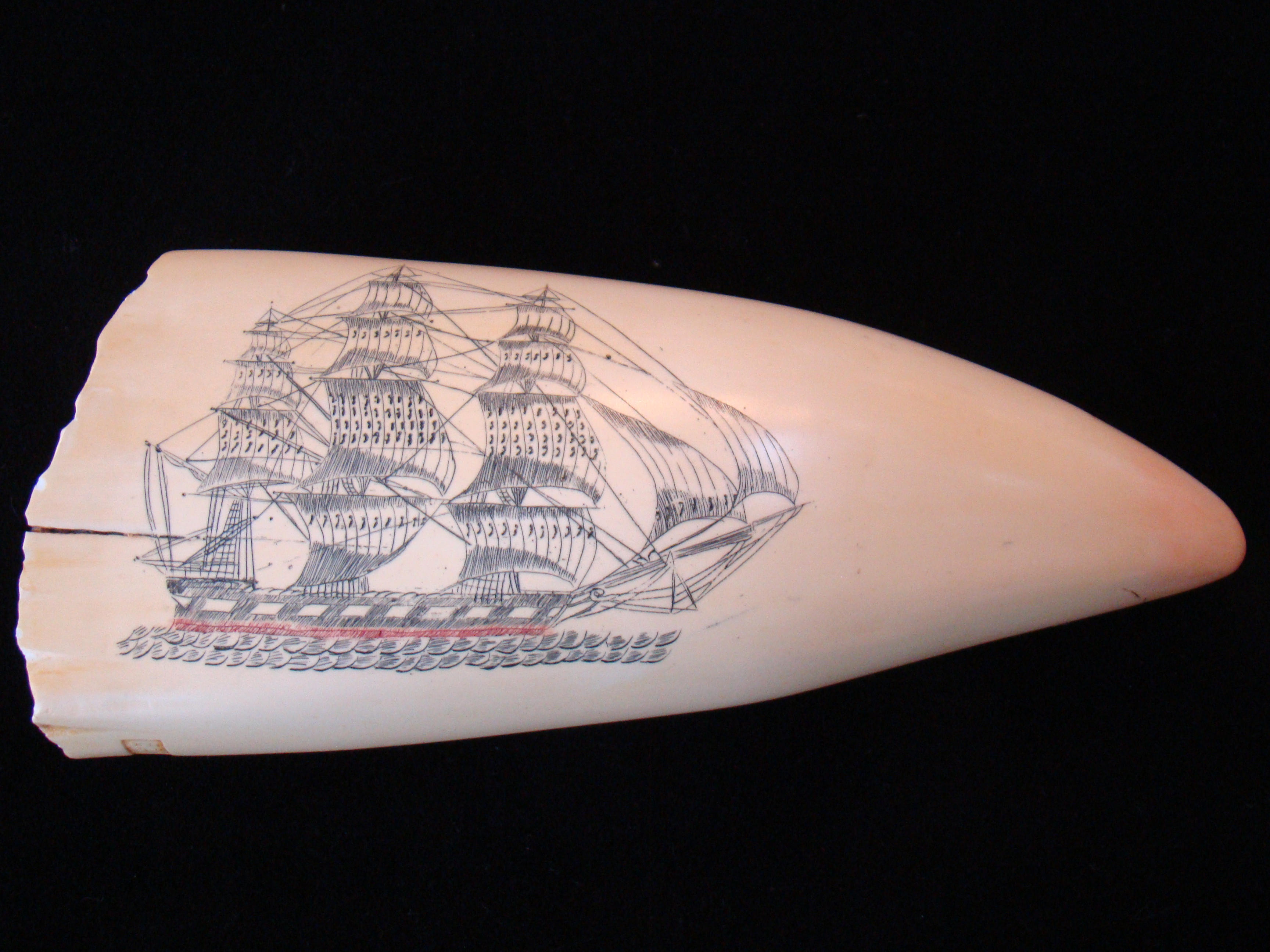 A very fine replica of a scrimshawed whale's tooth in the JOHN F. KENNEDY collection