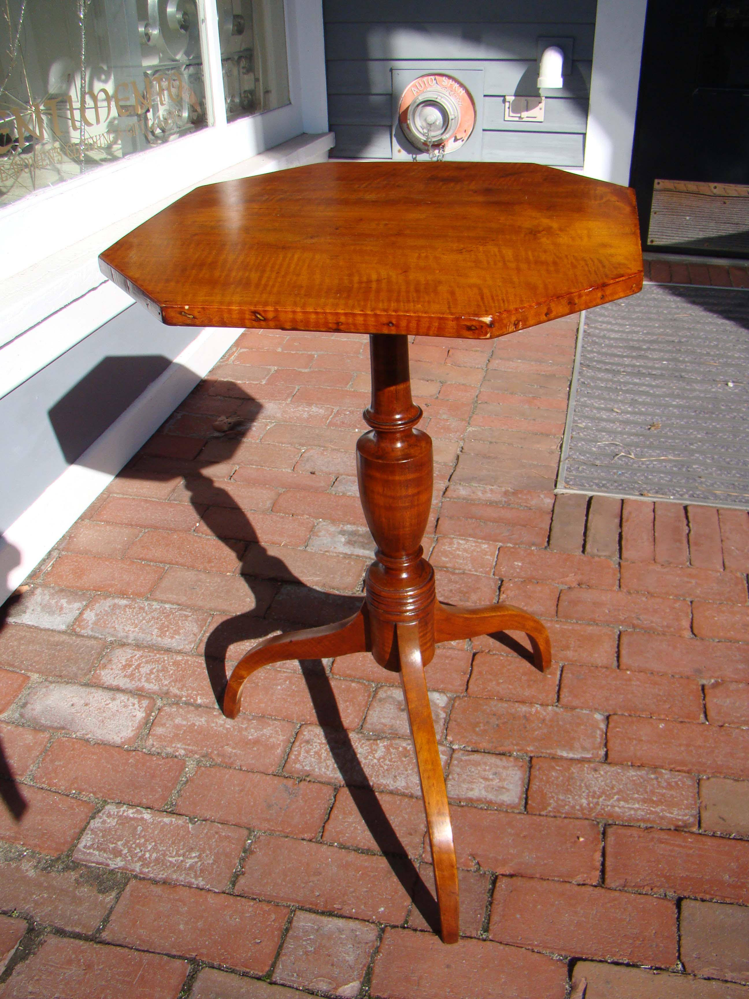 A beautiful early 19th century New England tiger maple candle stand with octagonal top circa 1810