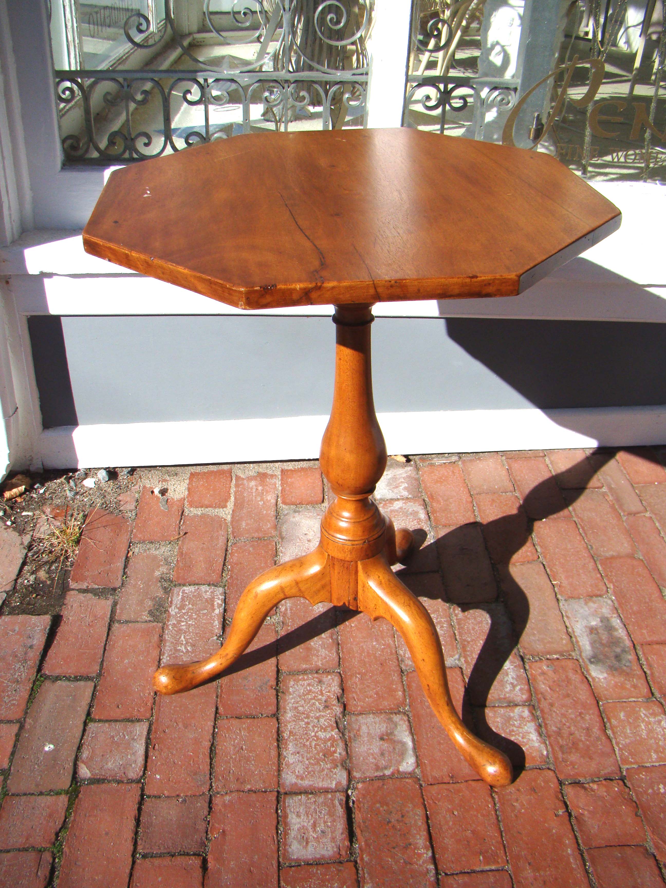 A fine late 18th century New England maple tilt-top candle stand circa 1790.