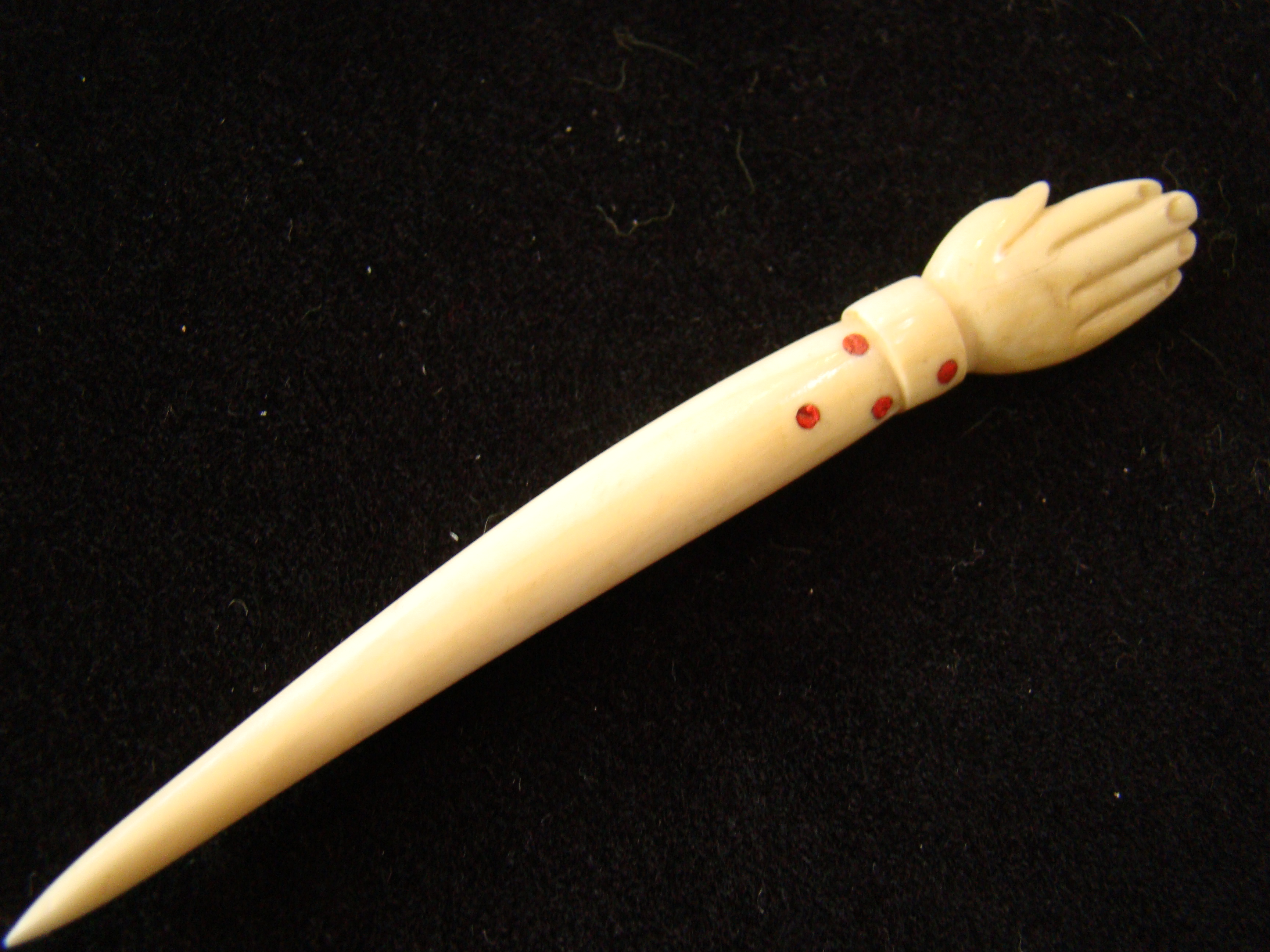An unusual 19th century sailor-made whalebone bodkin with open hand knob and inlaid with red dots — image 2