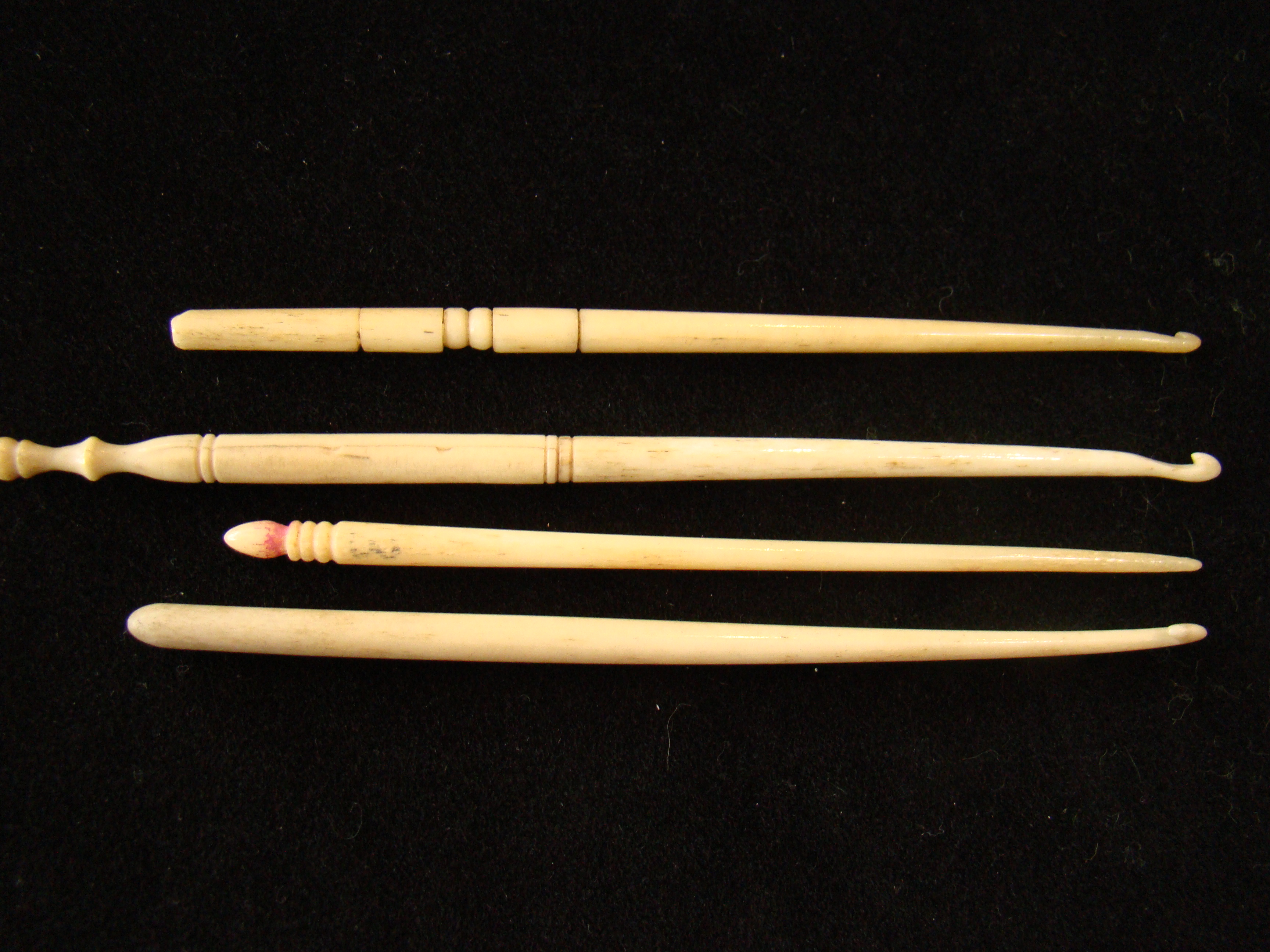 A group of four 19th century whalebone button hooks