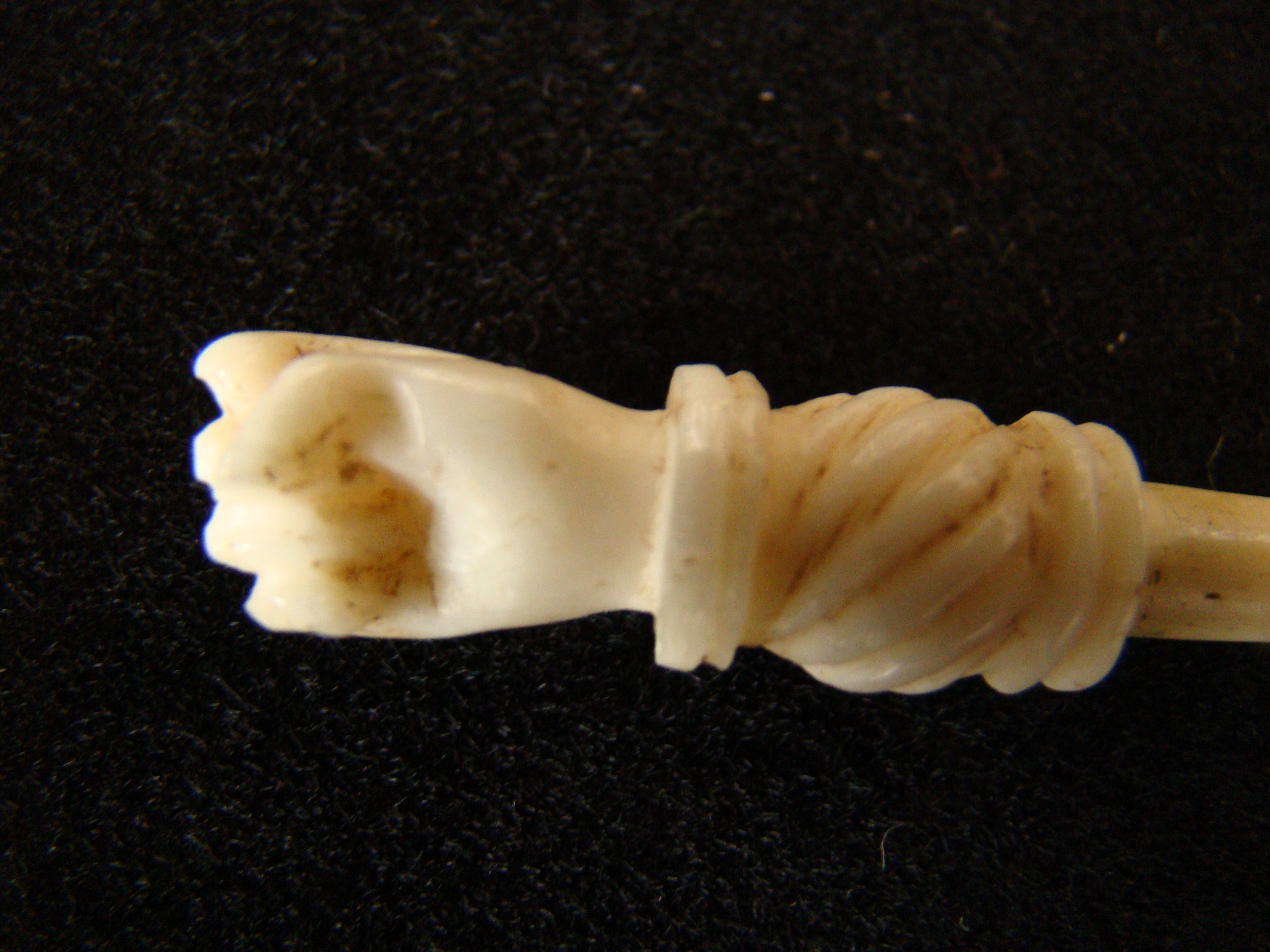 A fabulous group of four 19th century sailor made whalebone bodkins each having a hand or fist knob — image 2