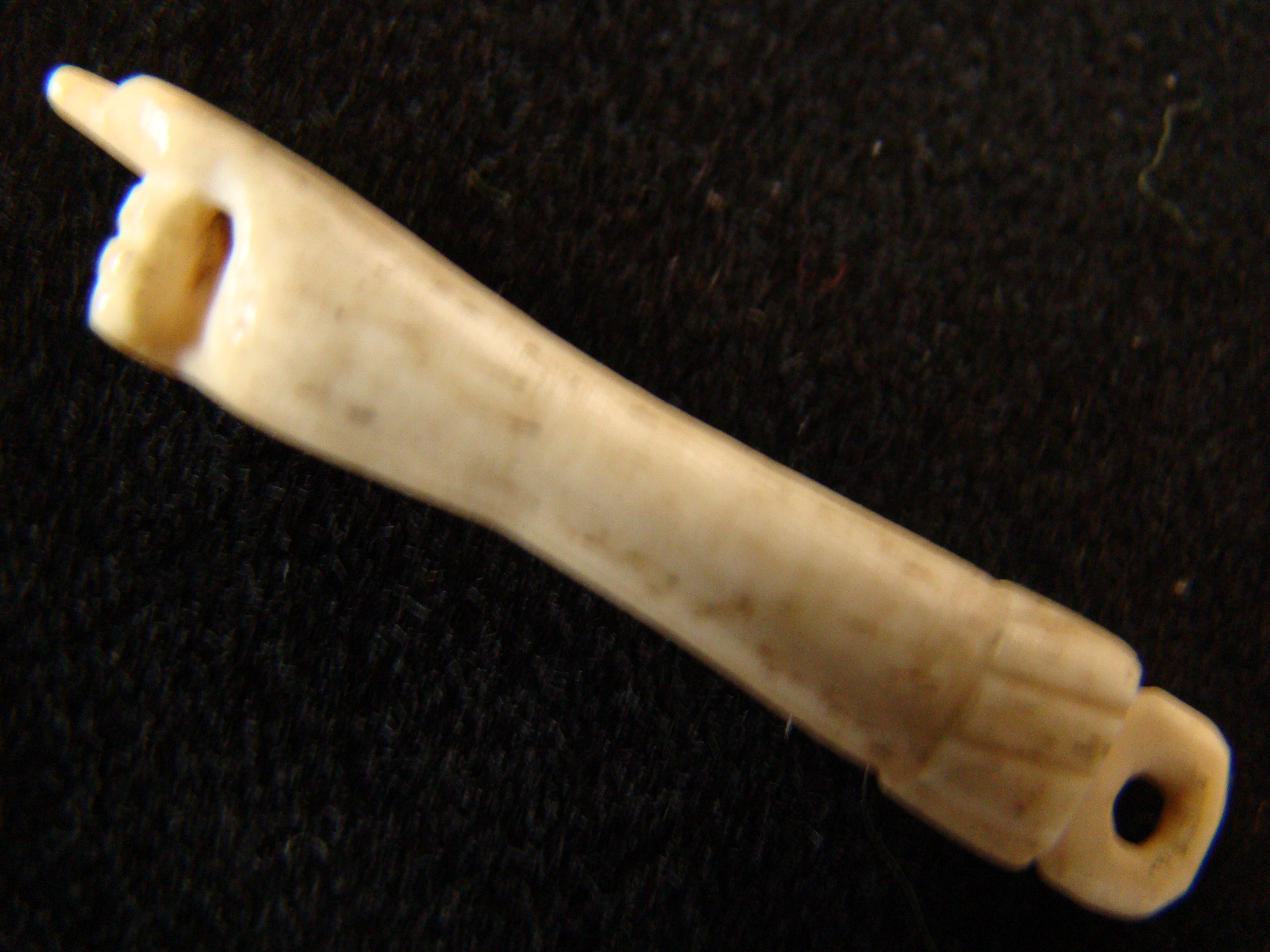 A fabulous group of four 19th century sailor made whalebone bodkins each having a hand or fist knob — image 4