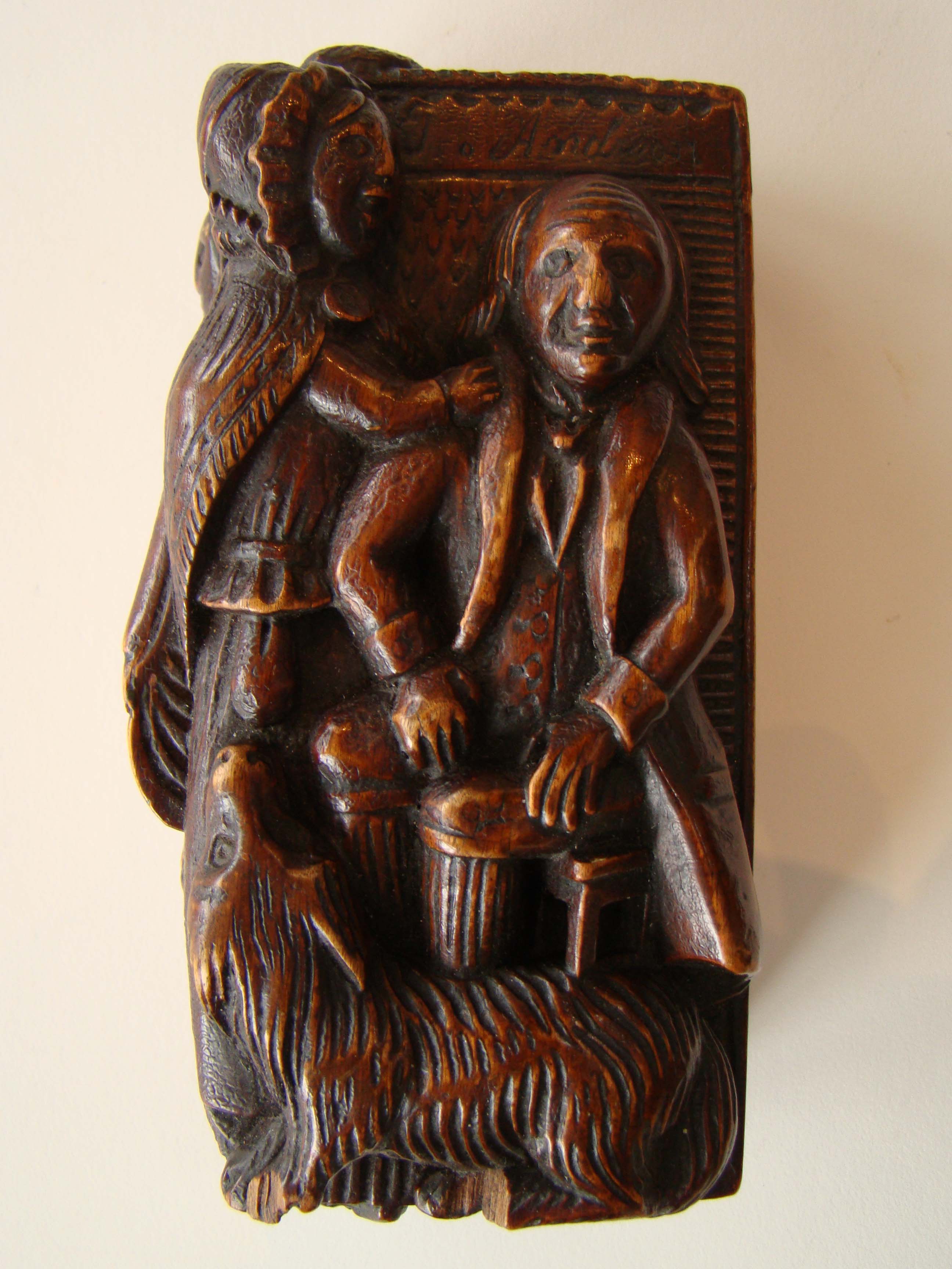 An early 19th century carved Scottish "Bobbie Burns" tobacco box circa 1796-1810
