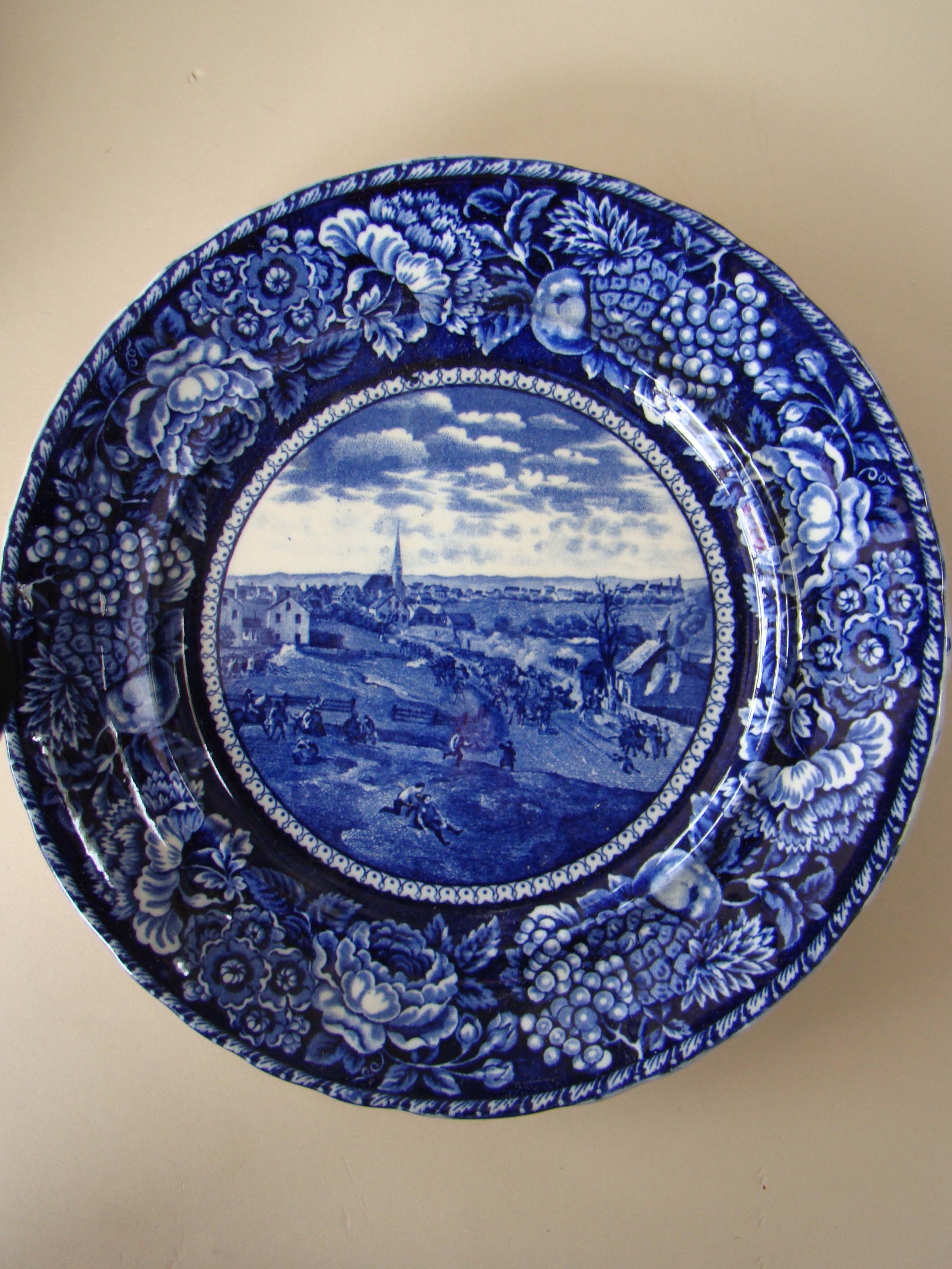 A rare historical Staffordshire plate depicting the Retreat of the British from Concord April 19, 1775