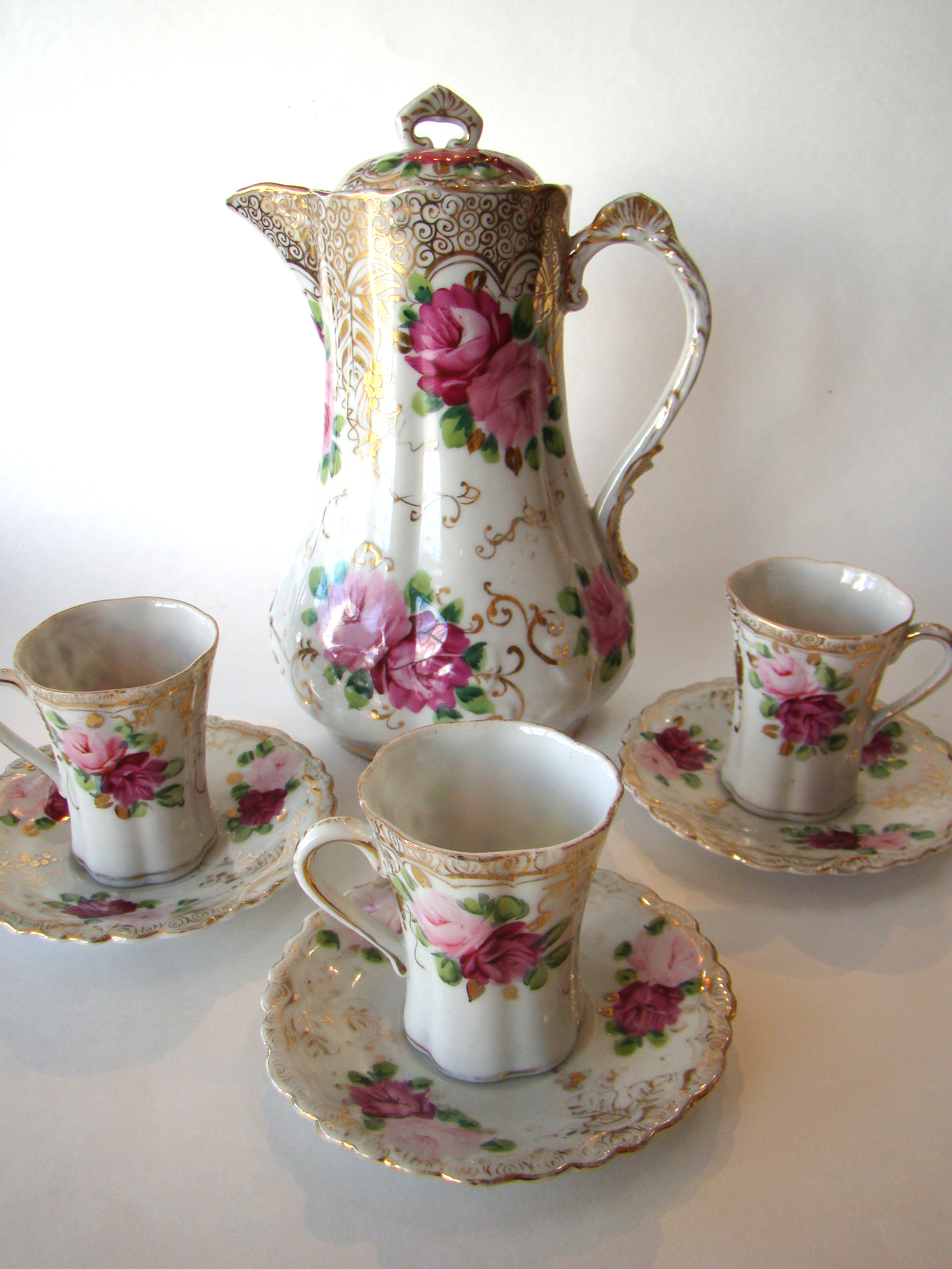 A beautiful vintage Japanese bone china chocolate pot with three matching cups and saucers circa 1890-1900