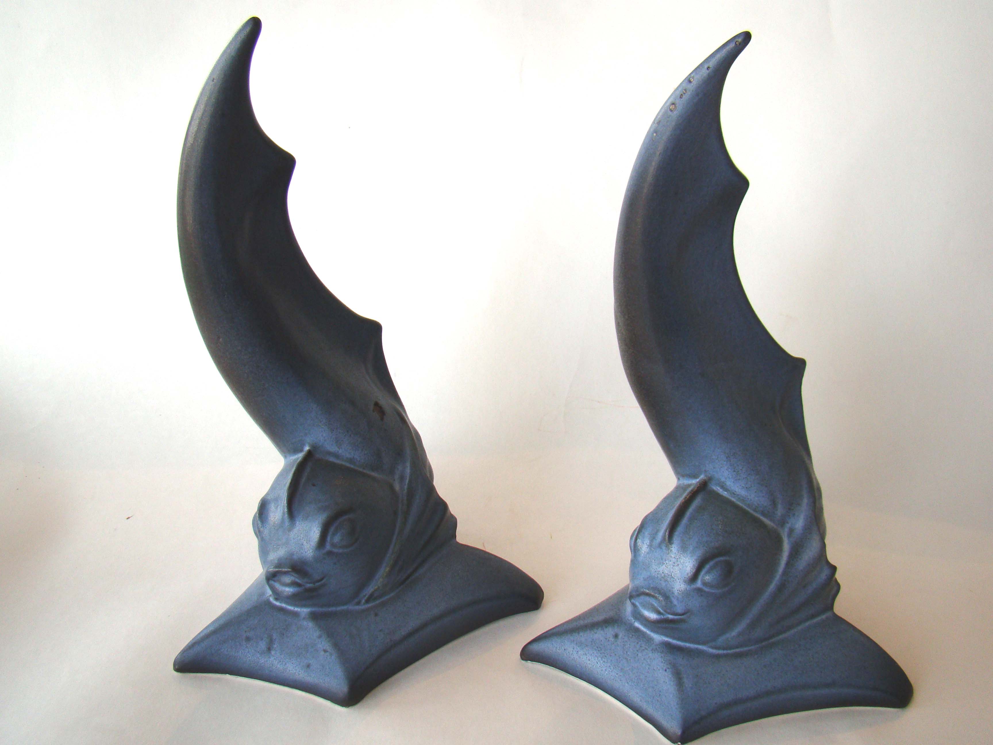 An important pair of Paul Bellardo hand sculpted bookends depicting dolphins circa 1965