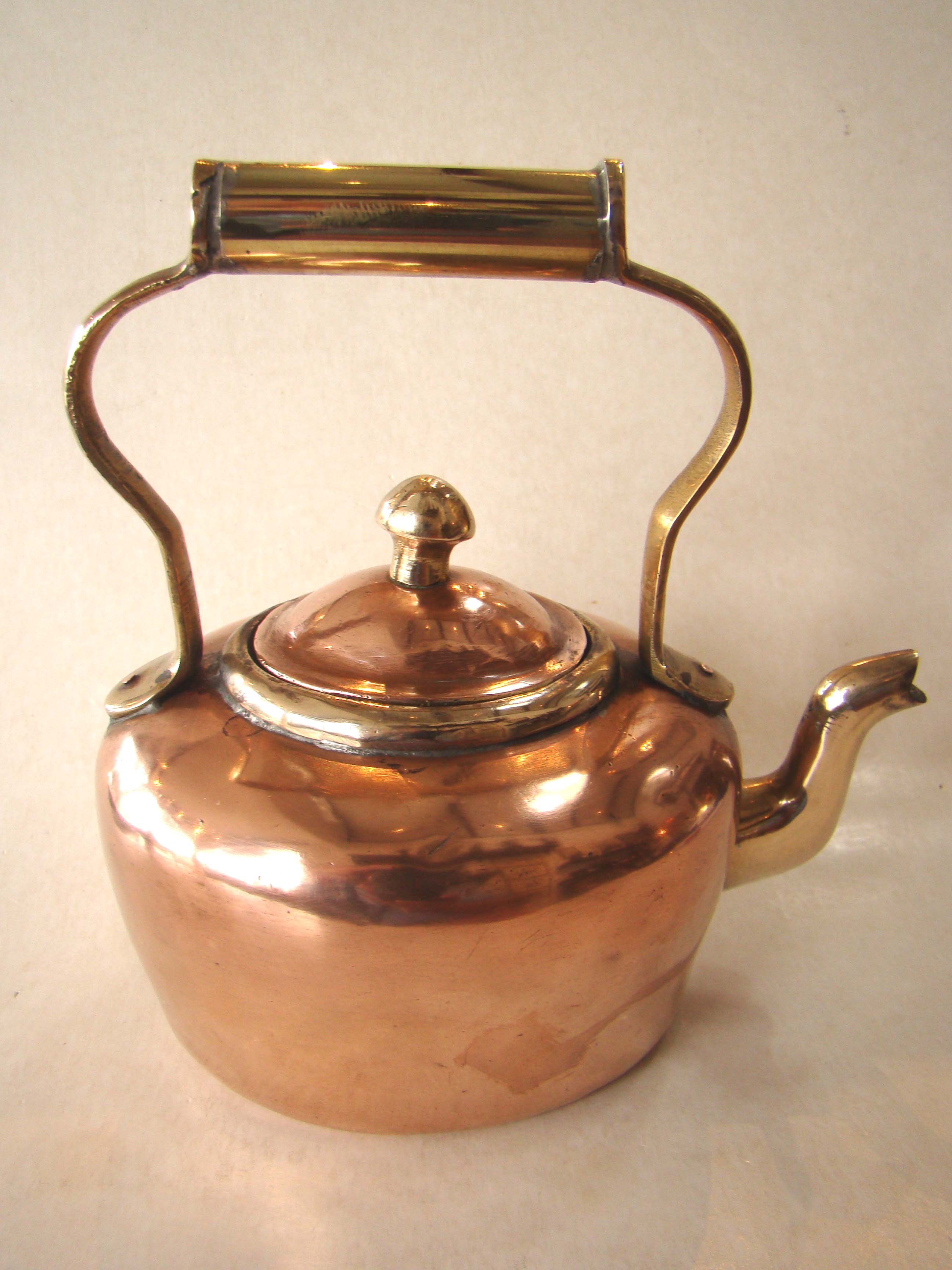 A fine diminutive Victorian copper and brass kettle circa 1850