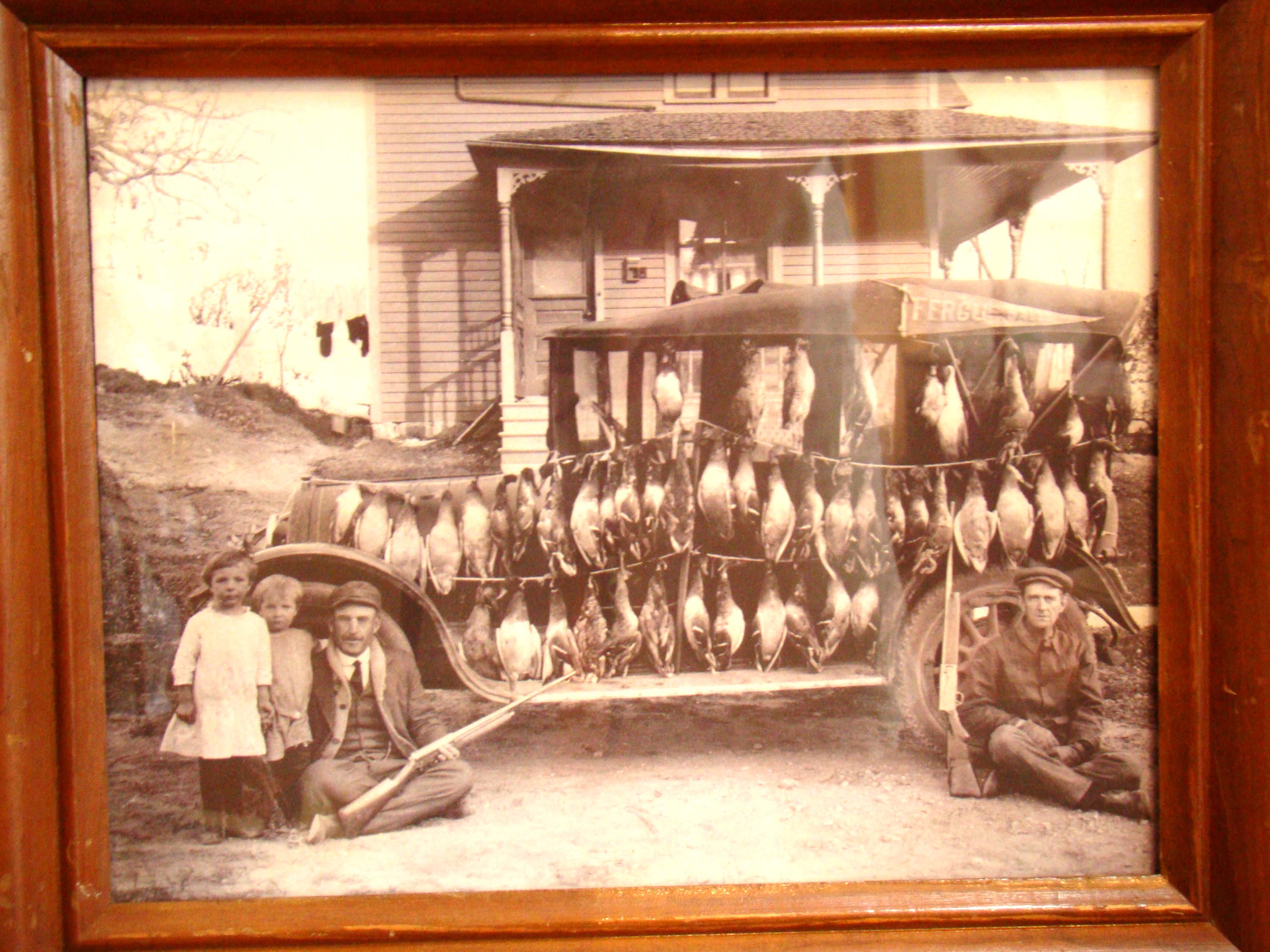 A wonderful early 20th century photo of duck hunters and their catch on display