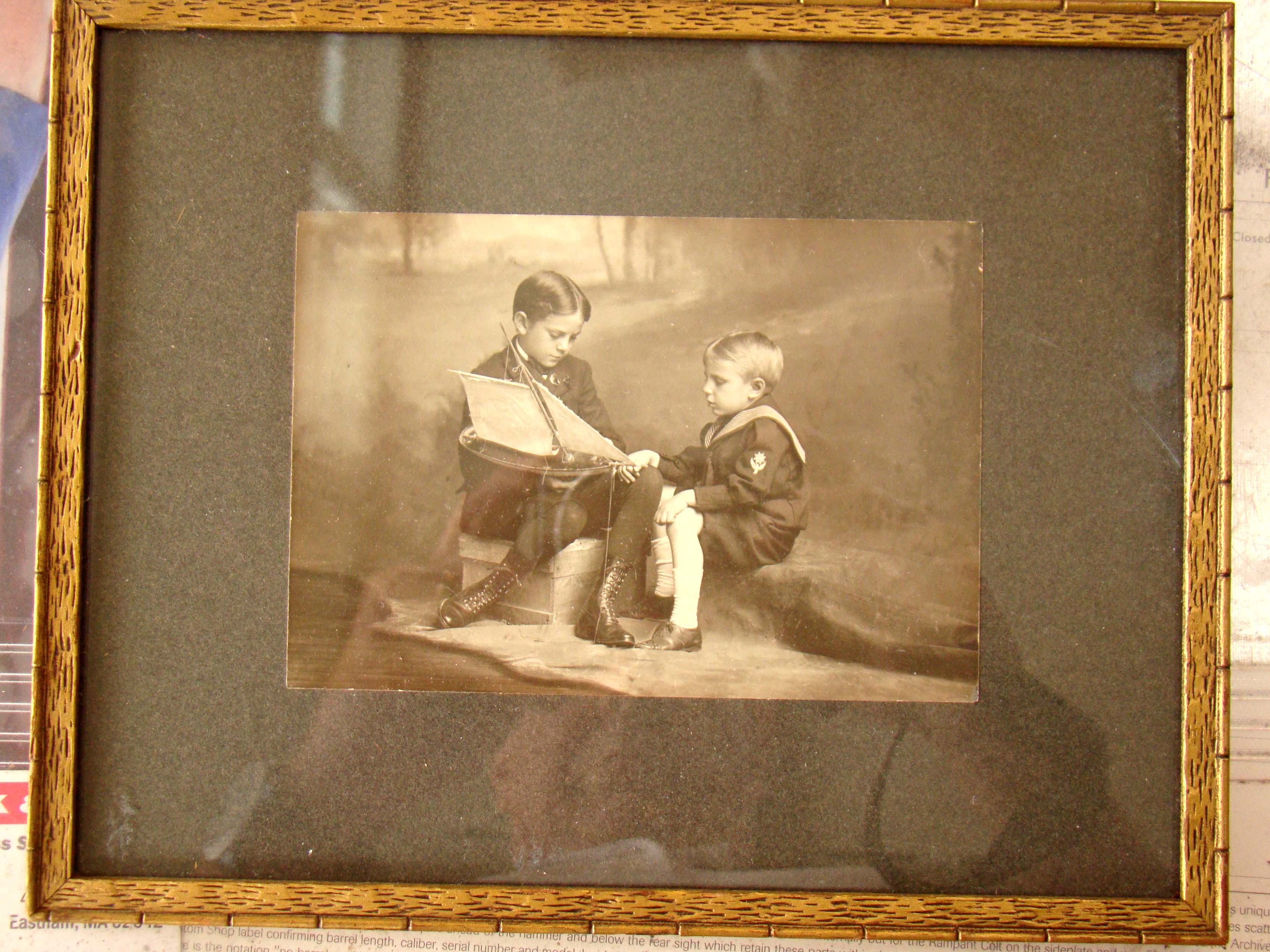 A fine vintage photo of two young boys examining a model pond boat circa 1900 — image 2