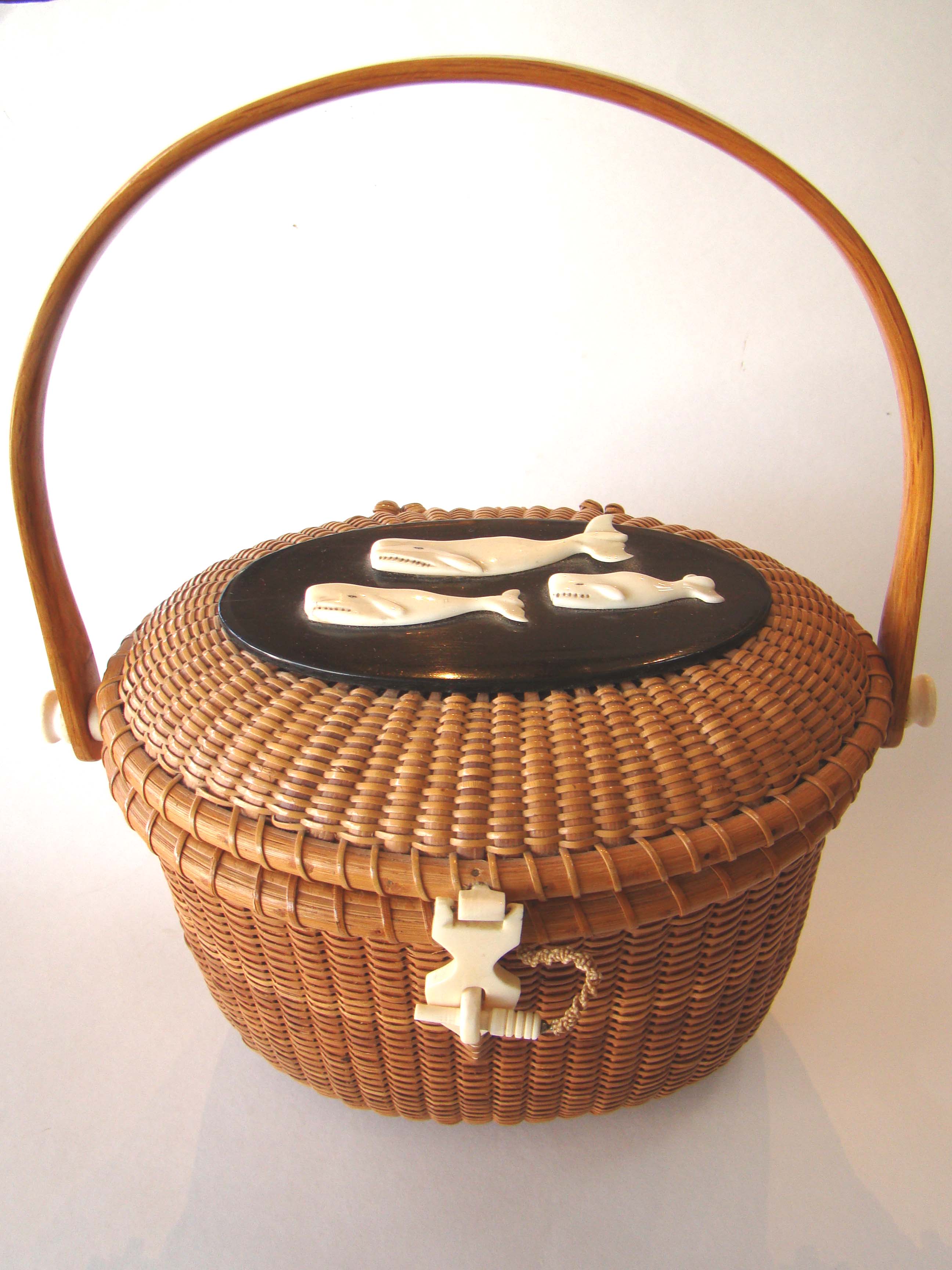 An exceptionally fine and important Nantucket covered basket purse made by the iconic basket maker Gladys Ellis circa 1970.