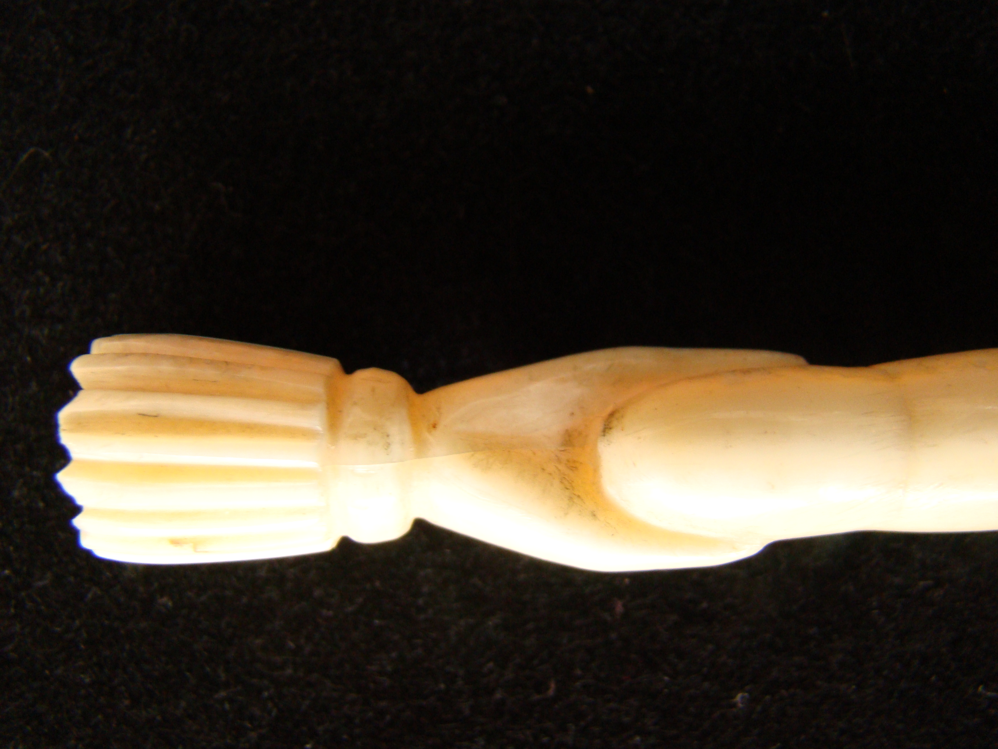 A highly RARE whale ivory bodkin depicting a hand holding a bodkin or fid circa 1850