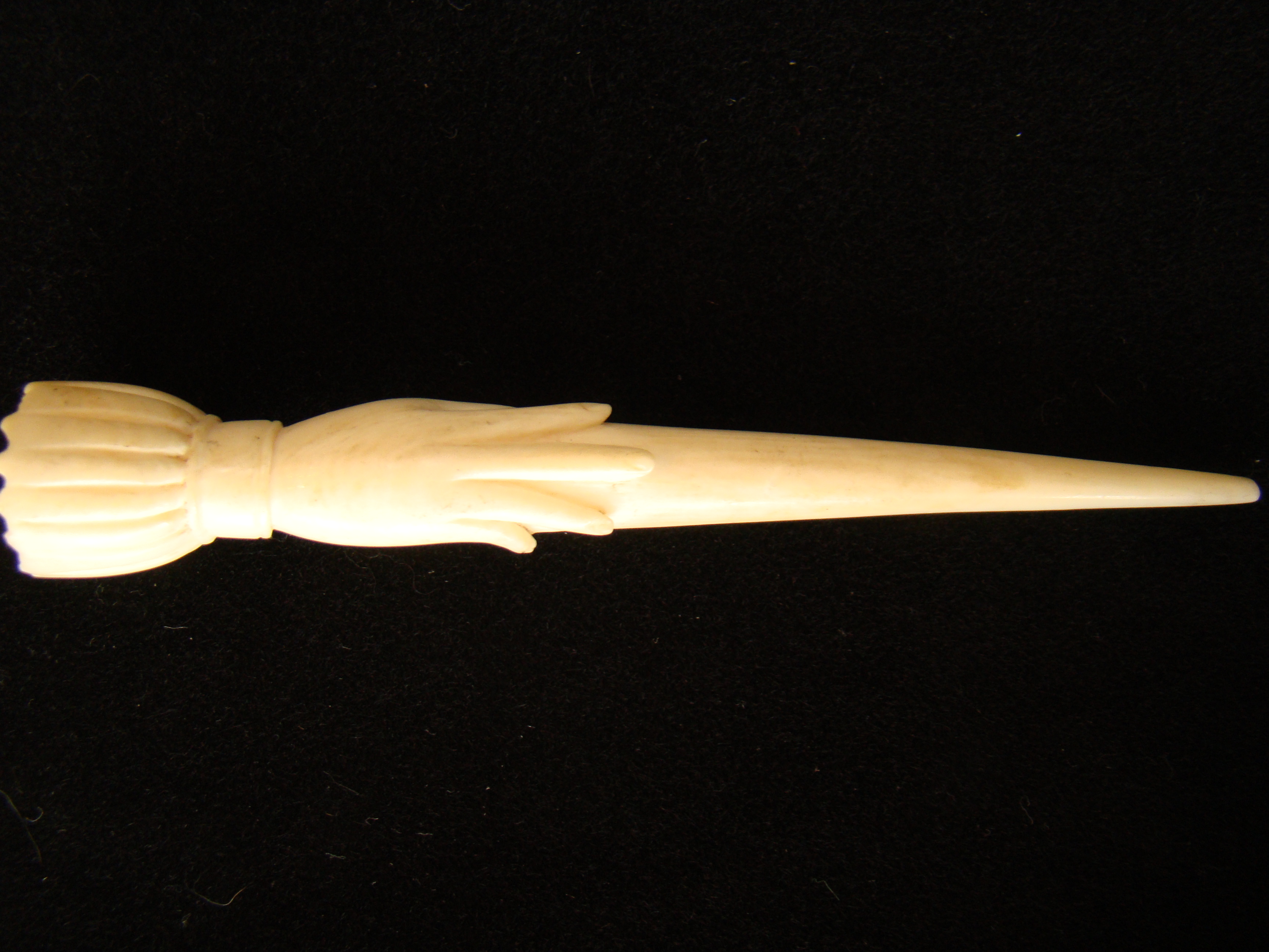A fine and rare whale ivory bodkin  in the form of a hand holding a fid or bodkin circa 1850 — image 2