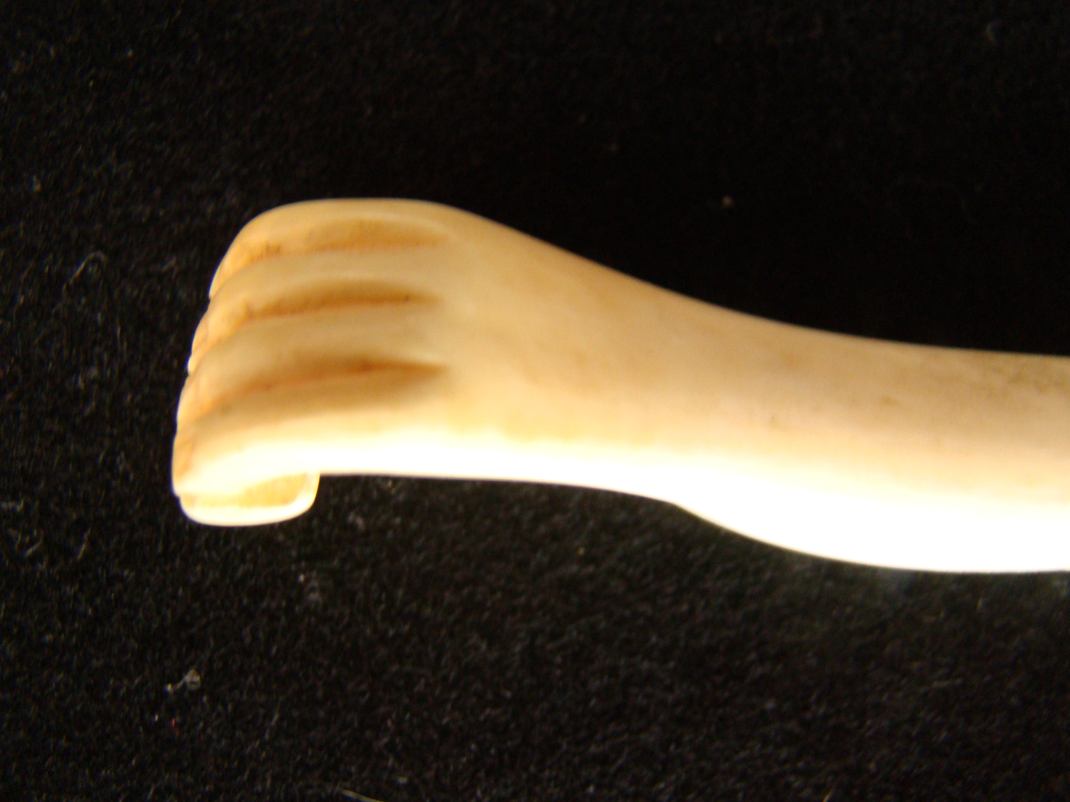 A sailor -carved whale ivory bodkin depicting a hand holding a small box or book circa 1850 — image 2