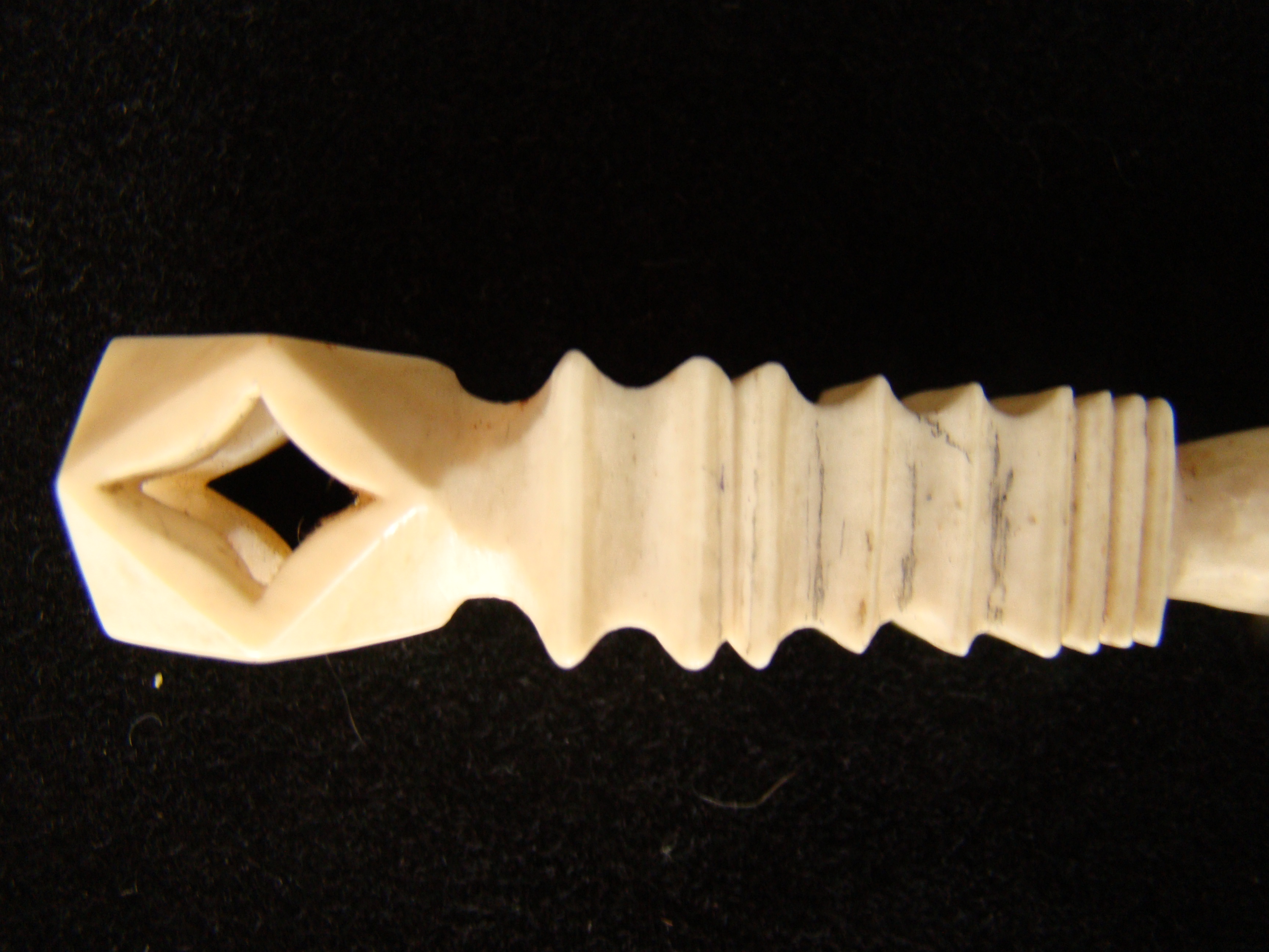 A rare and unusual whale ivory bodkin with open diamond shaped knob circa 1850