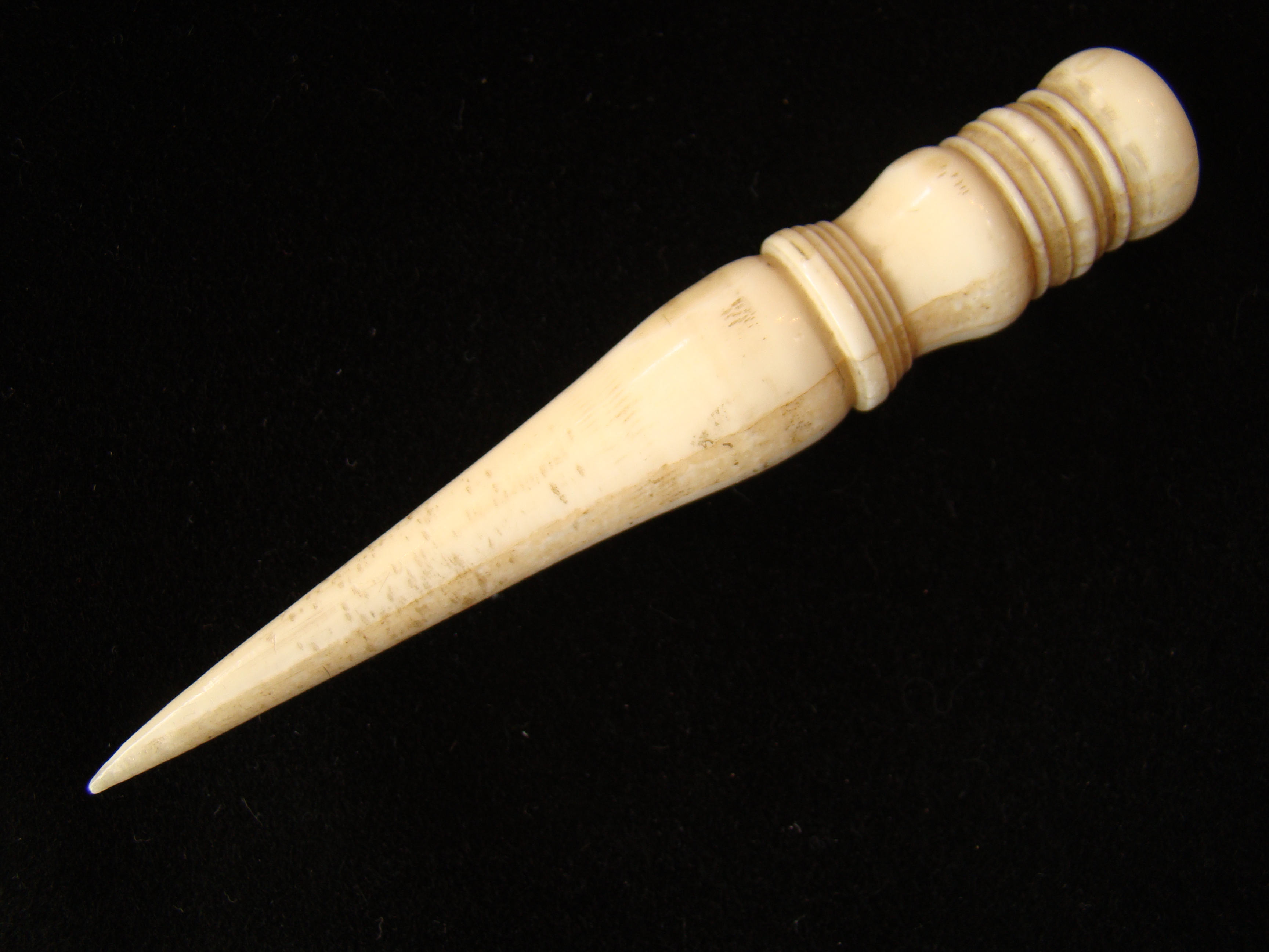 An usually large whale ivory bodkin or small fid with elaborate turnings circa 1850