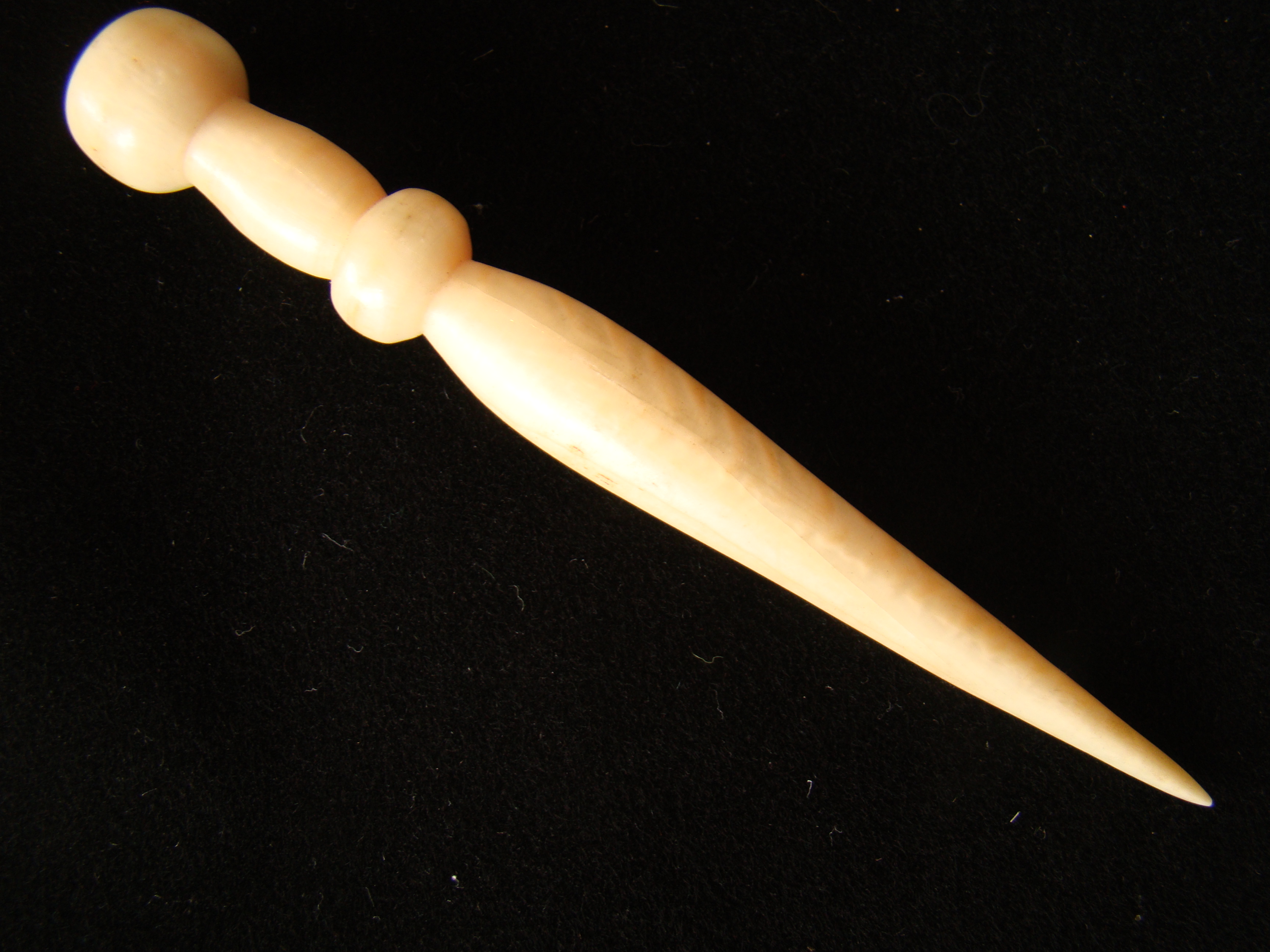 A large whale ivory bodkin with double knobs circa 1850