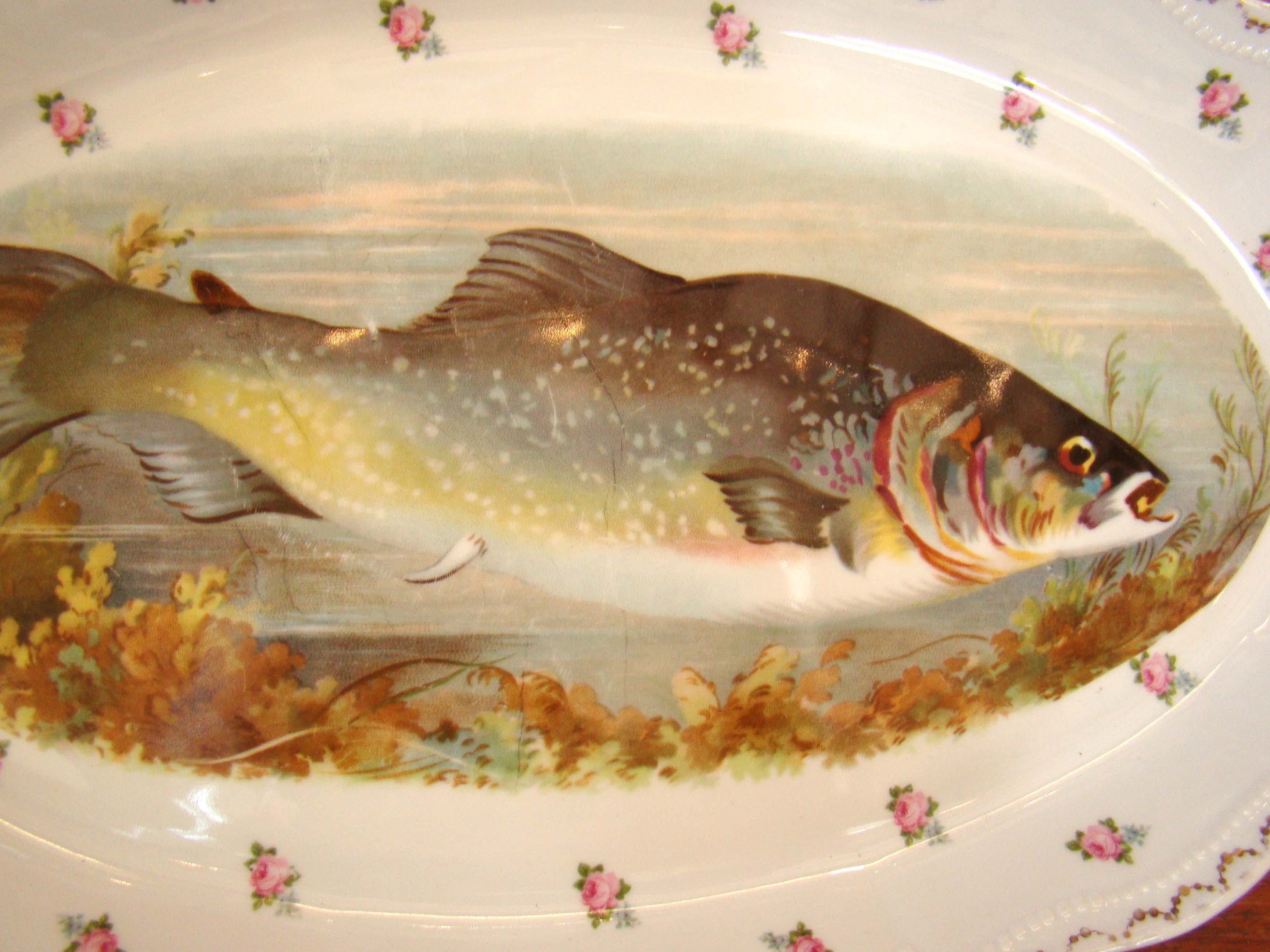 A fine hand painted Royal Austrian fish serving platter and two matching side dished circa 1910