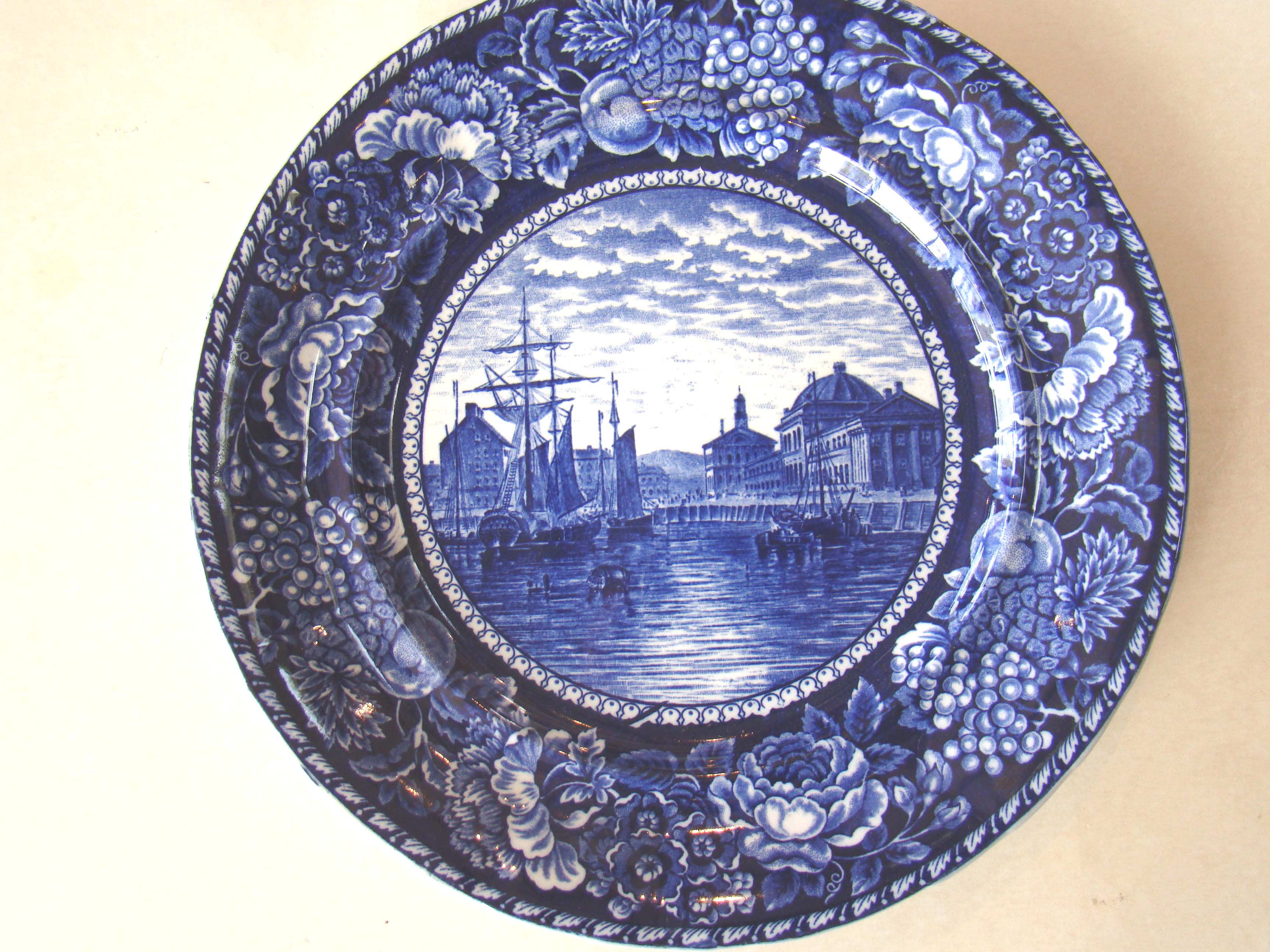A fine souvenir plate depicting Faneuil Hall as seen from Boston Harbor circa 1900.