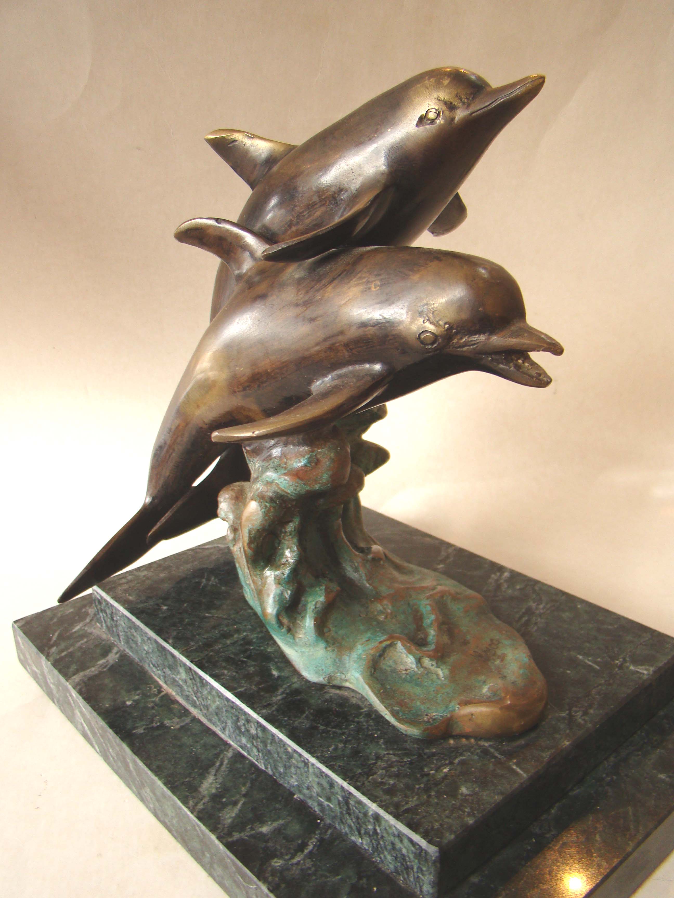 A wonderful solid bronze sculpture depicting two dolphins mounted on a green marble base — image 2