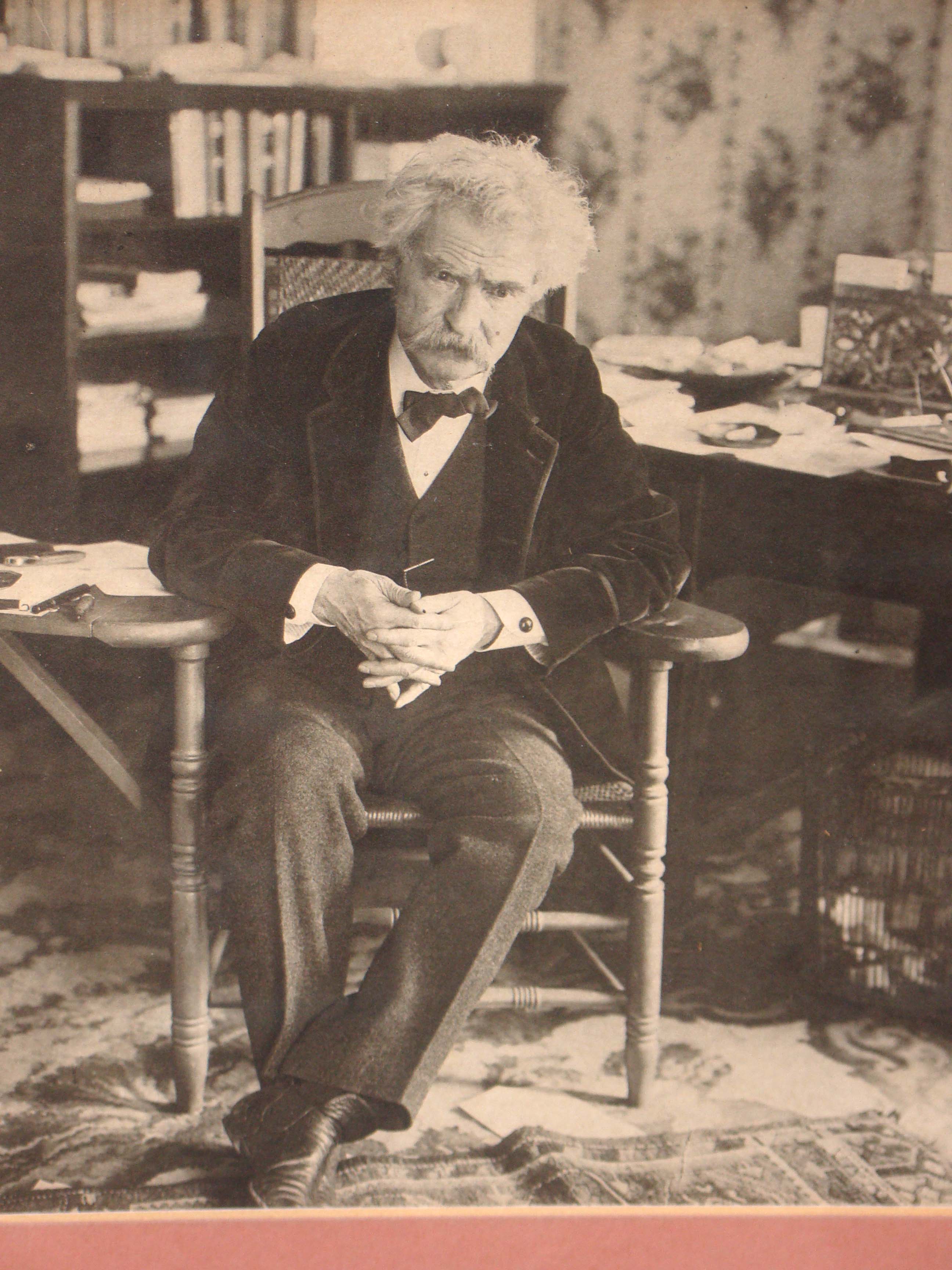 A fine and rare photograph of Mark Twain (Samuel L. Clemens) along with a clipped signature signed "Yos truly, Samuel L. Clemens, Mark Twain"