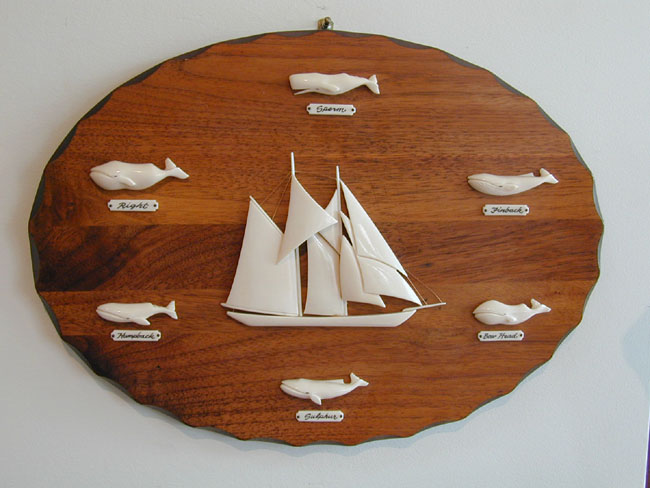 Six Carved Whale Ivory Whales Surrounding A Carved Ivory Sailing Ship c. 1977