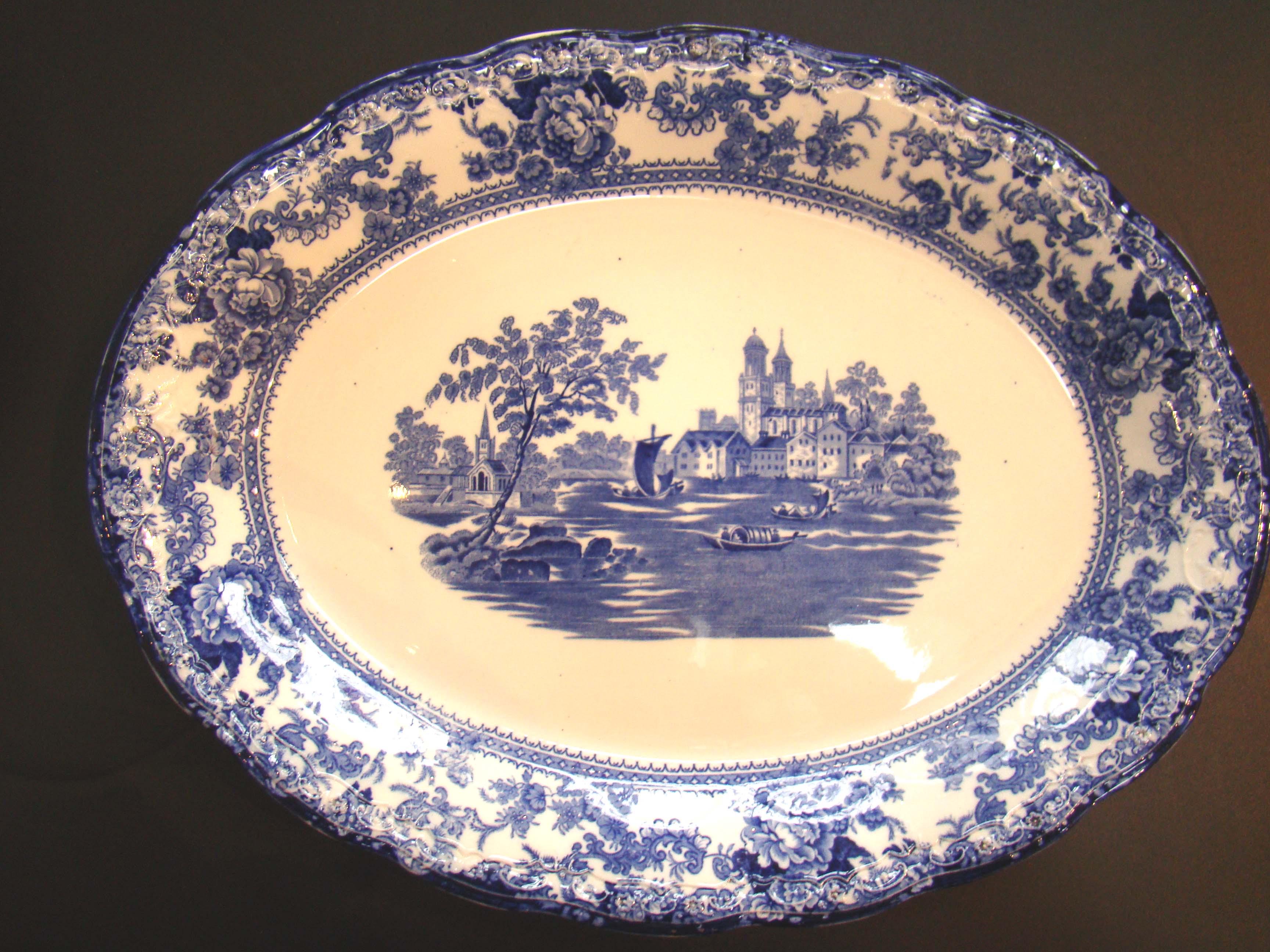 A beautiful antique flow blue serving platter by Colonial Pottery of Stoke, England, circa 1880-1900