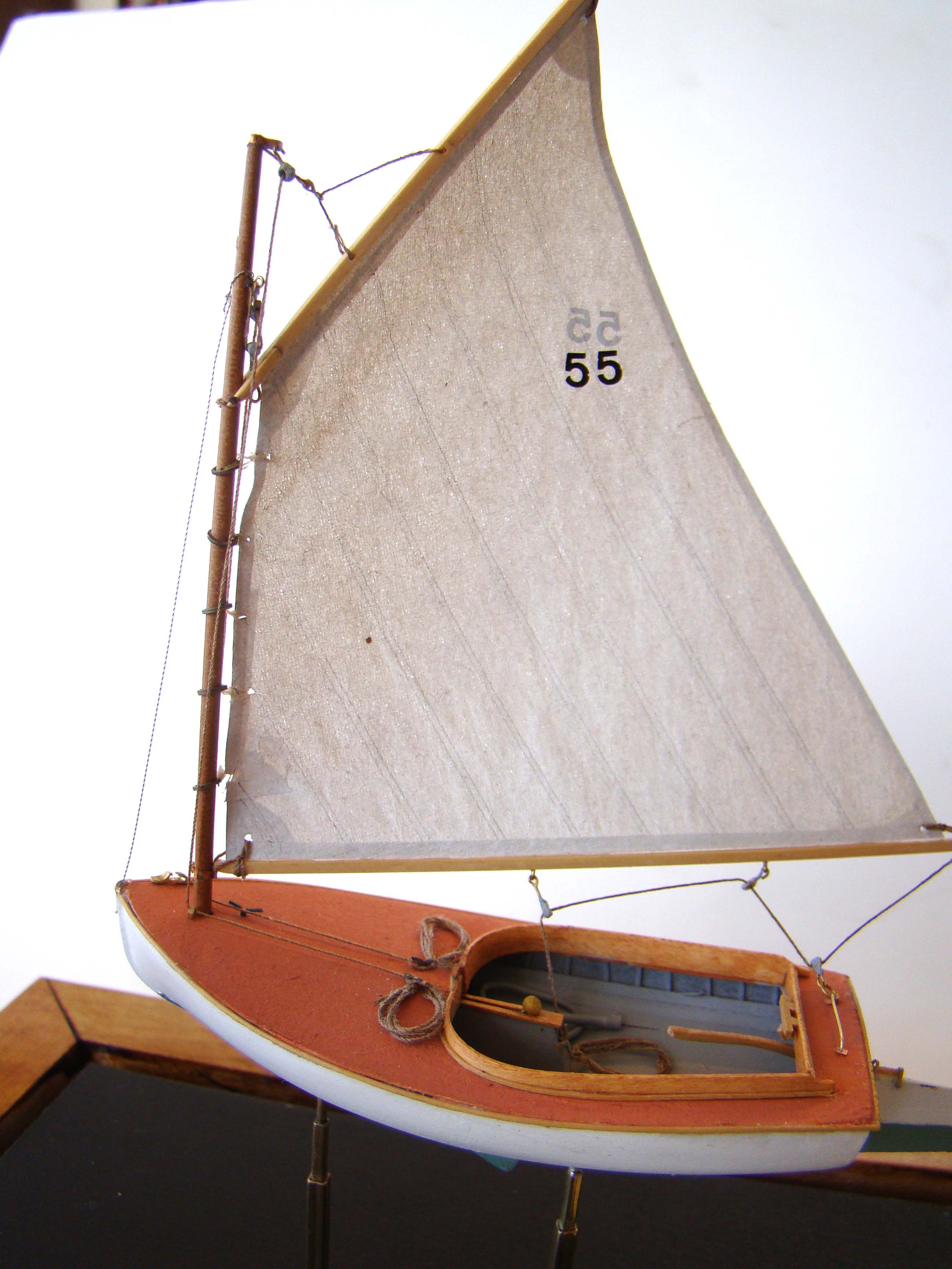 An exceptionally well made scale model of a Beetle Cat Boat circa 1921