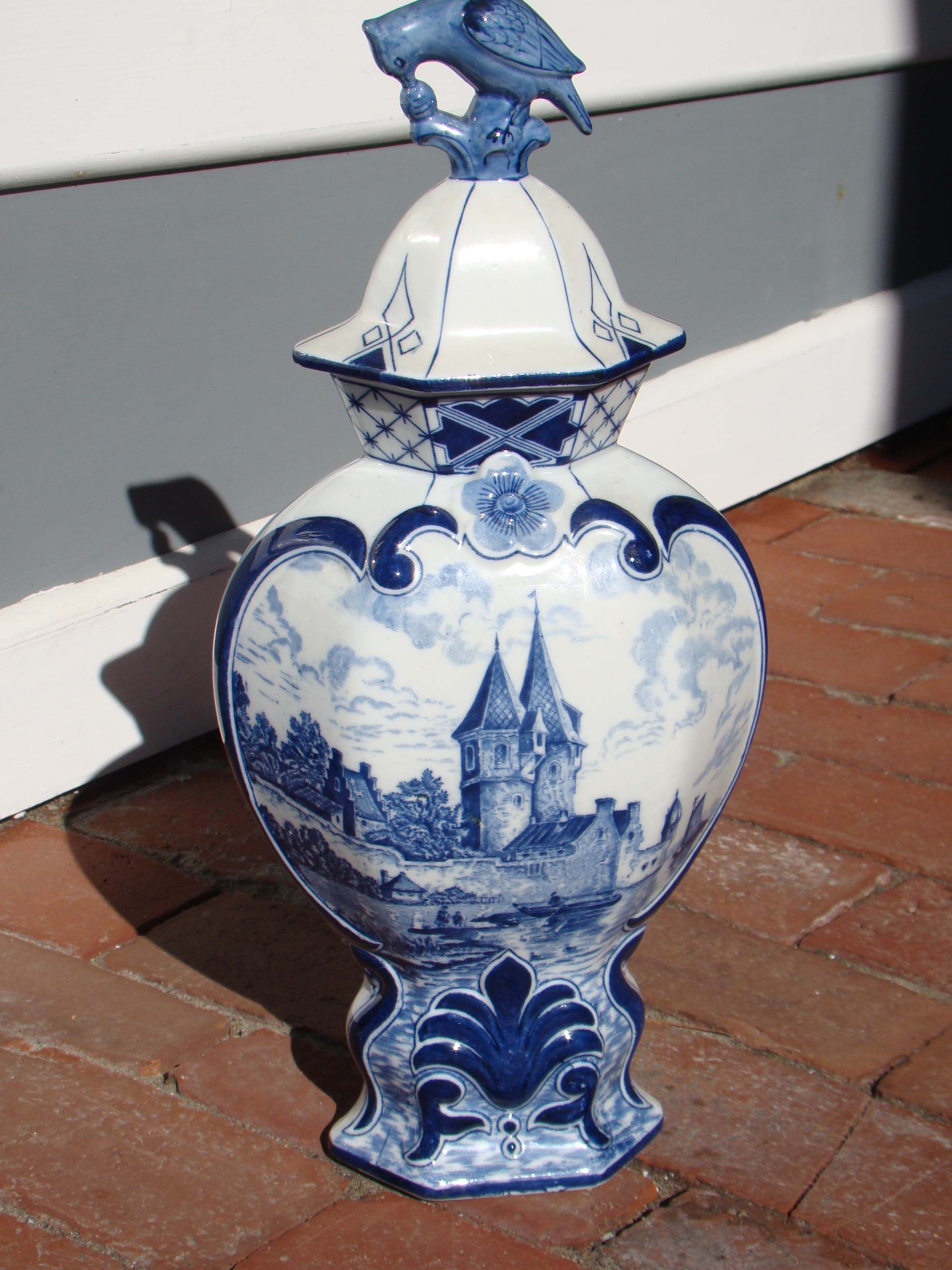 A fine vintage hand painted Dutch Delft covered jar with partridge finial