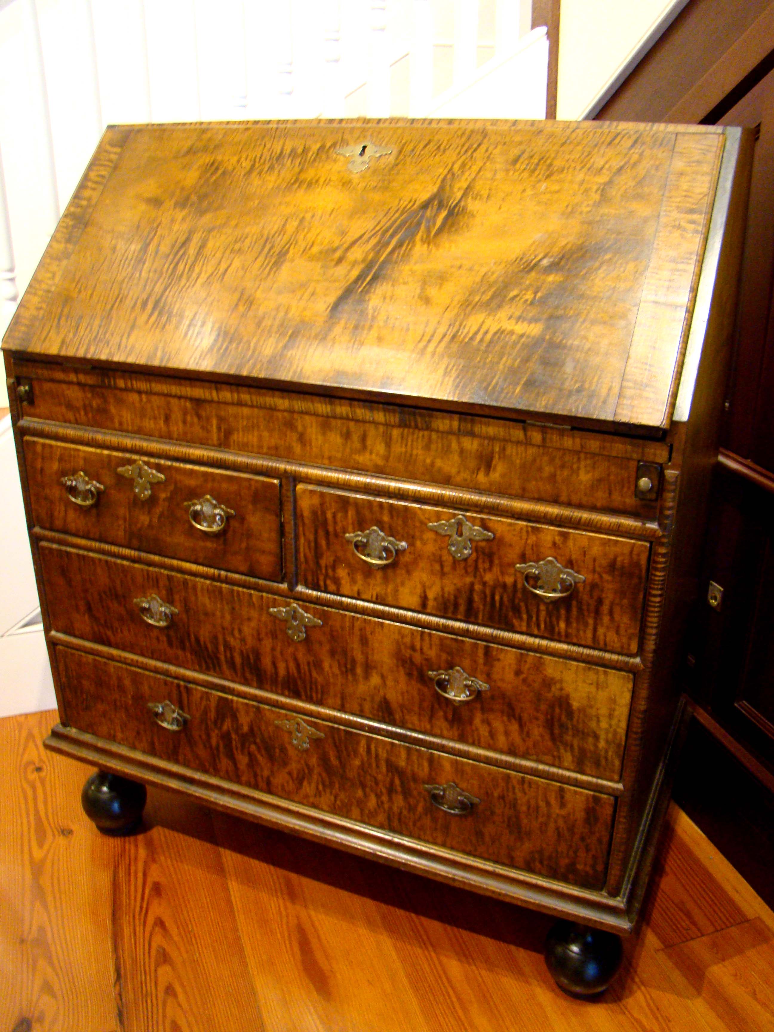An exceptionally fine contemporary William & Mary style tiger maple slant lid desk